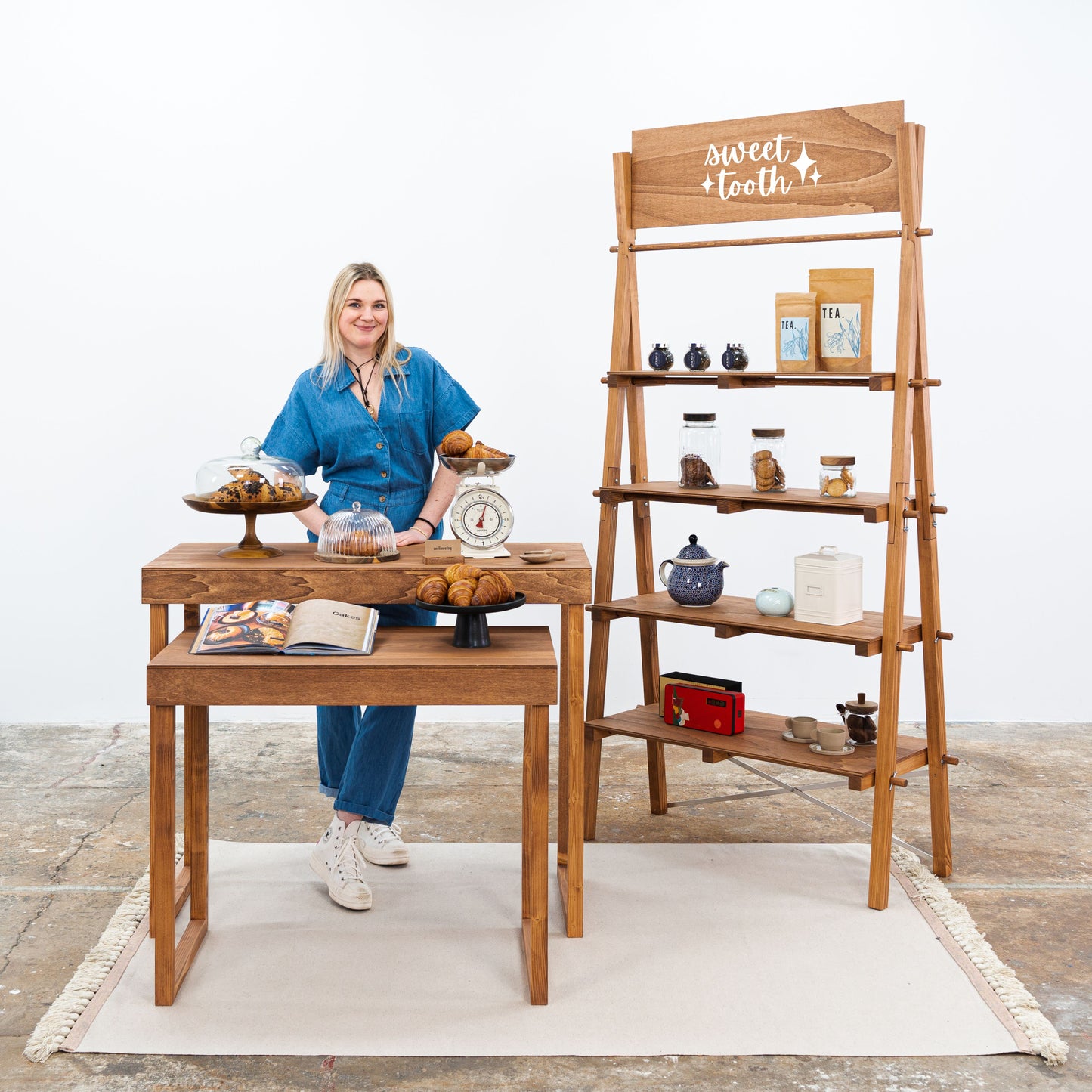 Retail booth set with display shelving and product risers