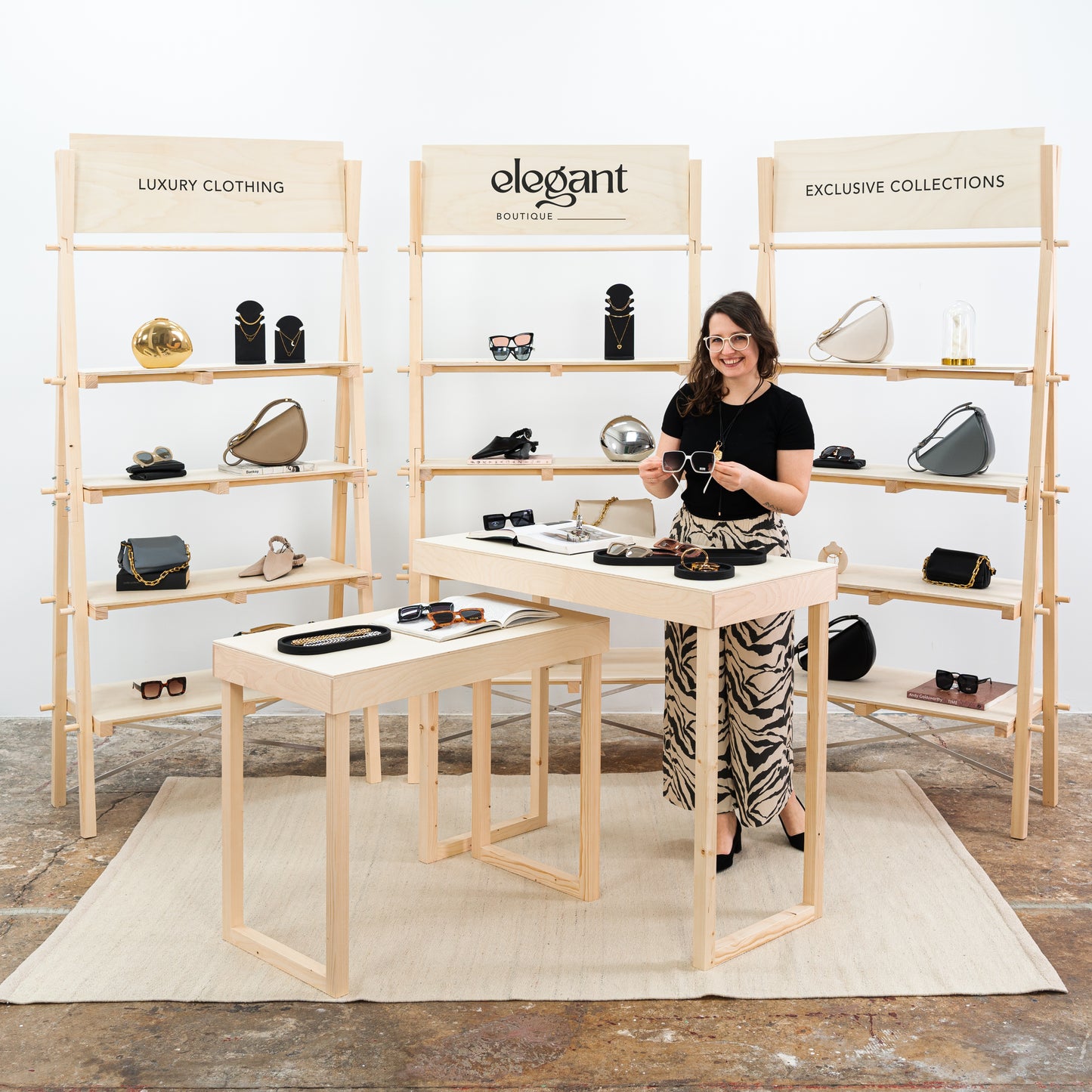 Full trade show setup with shelving units and tables – natural wood finish