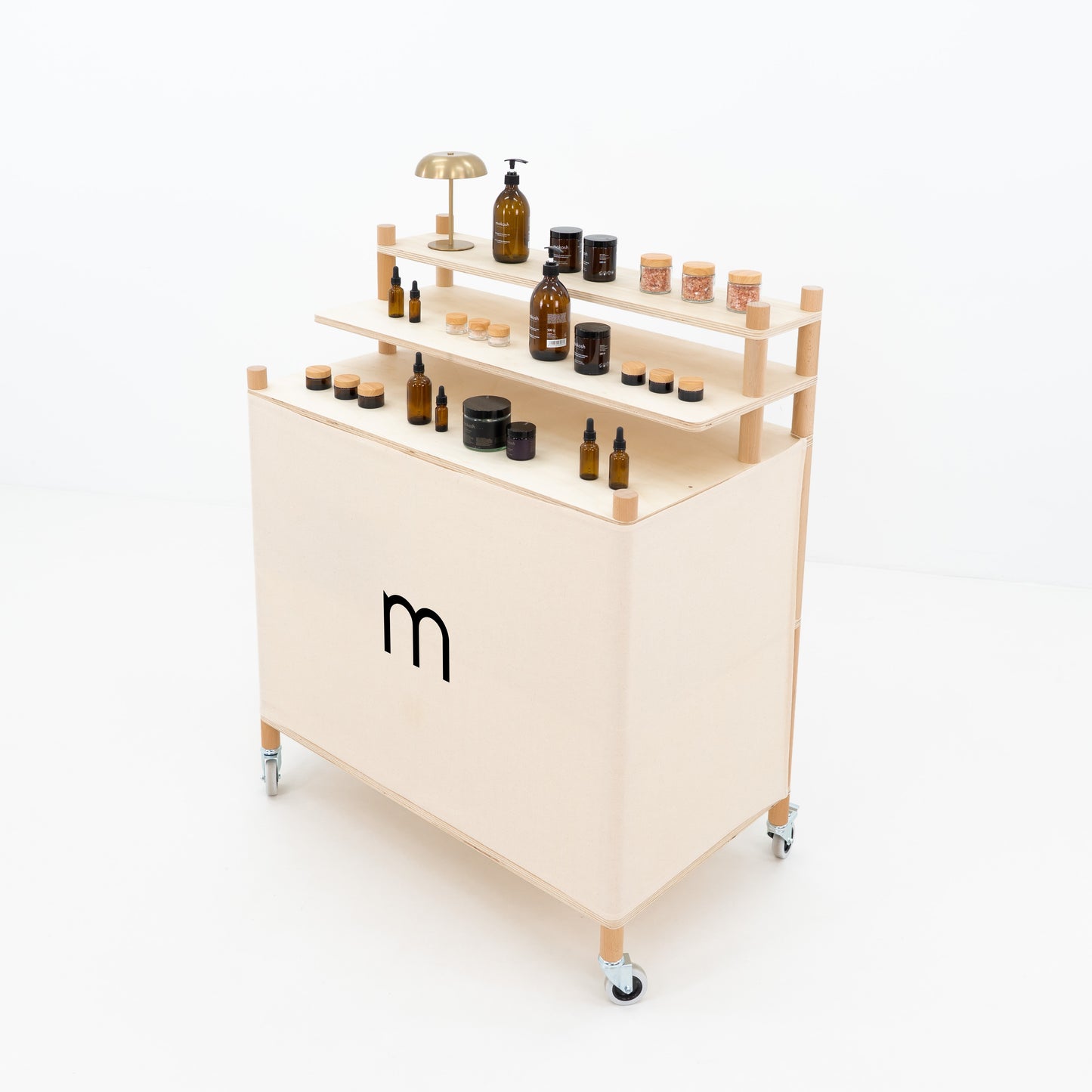 Side angle of portable checkout counter showing raised product shelves and rear storage space