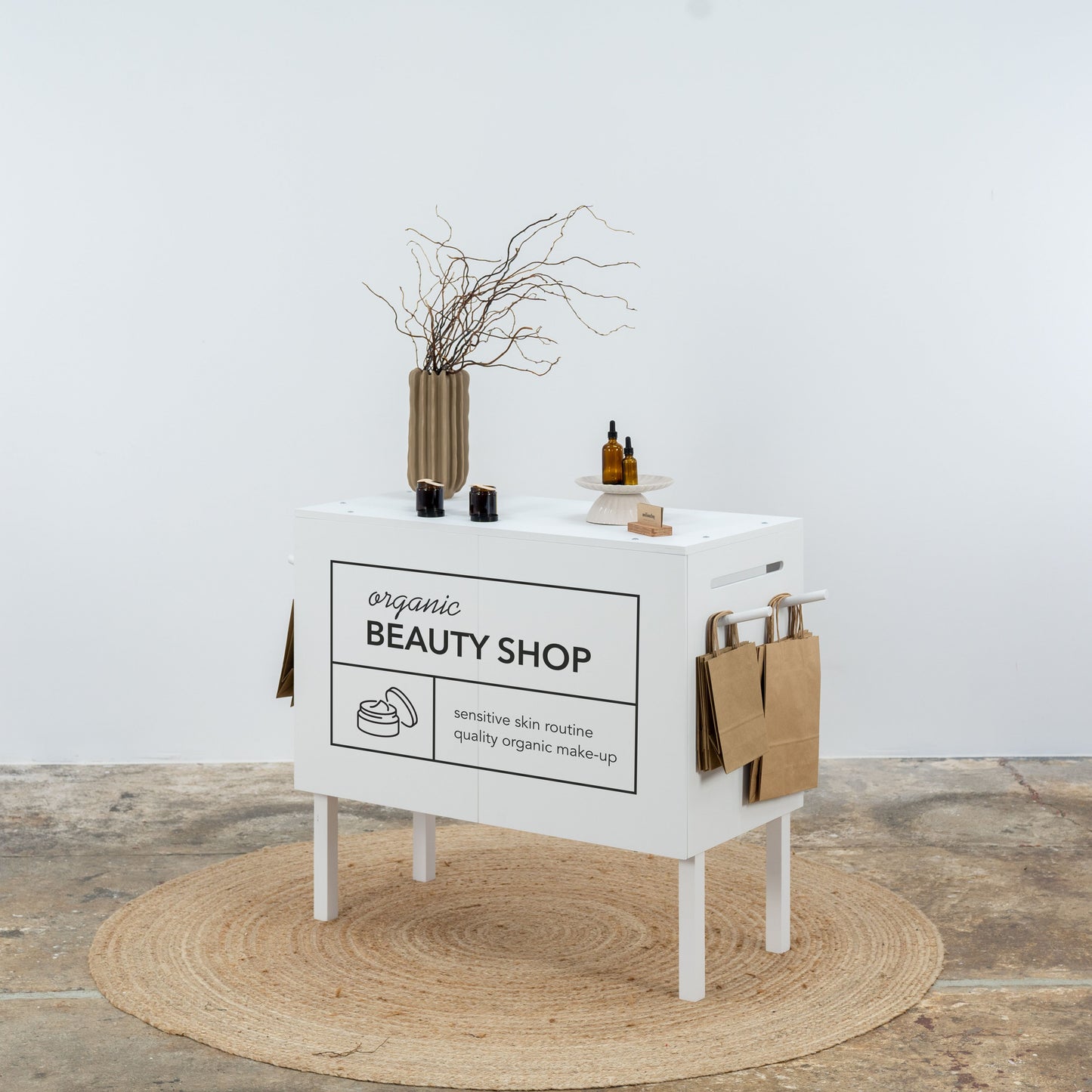 Flat-pack white retail check stand with logo panel