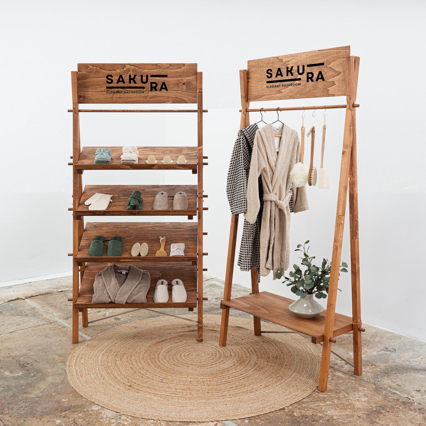 Fashion trade show stand with slanted shelves and garment rack