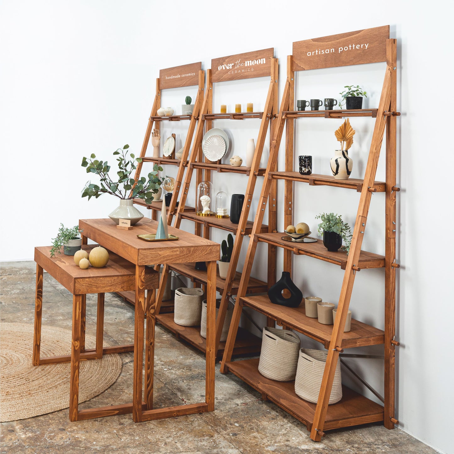 Sleek coffee color display shelves and cascading tables for a professional presentation at trade shows