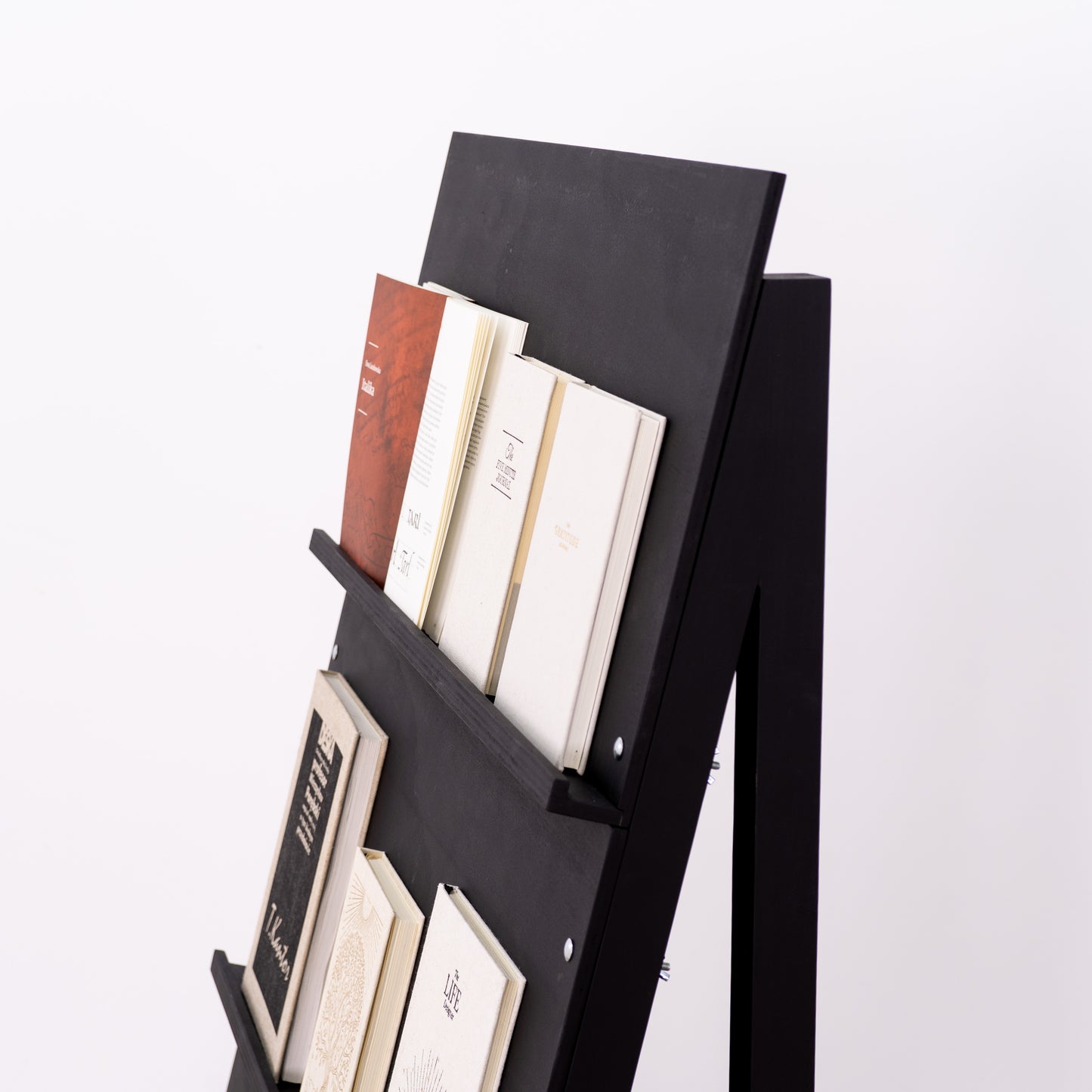 Modern event display stand featuring collectible printed media