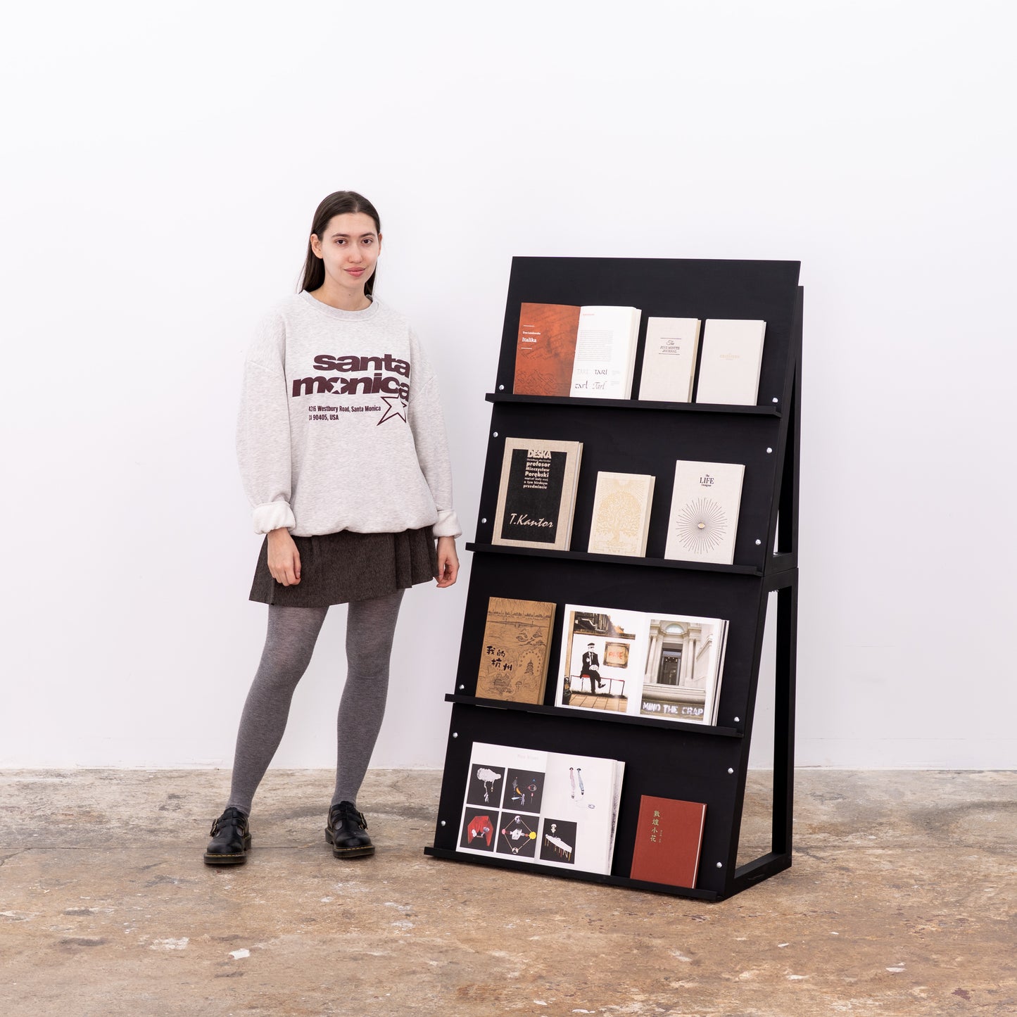 Compact dual shelving for brochures, postcards, and portfolios