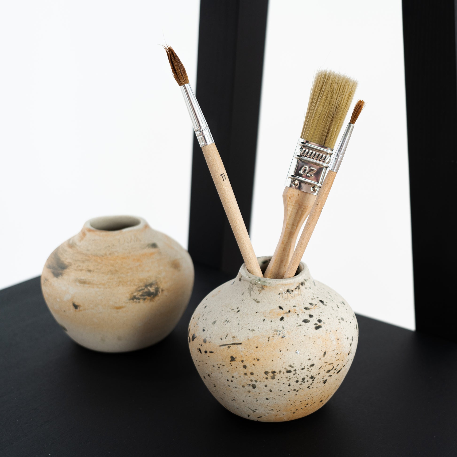 Flat-pack A-frame display shelf with a modern black finish for trade fairs