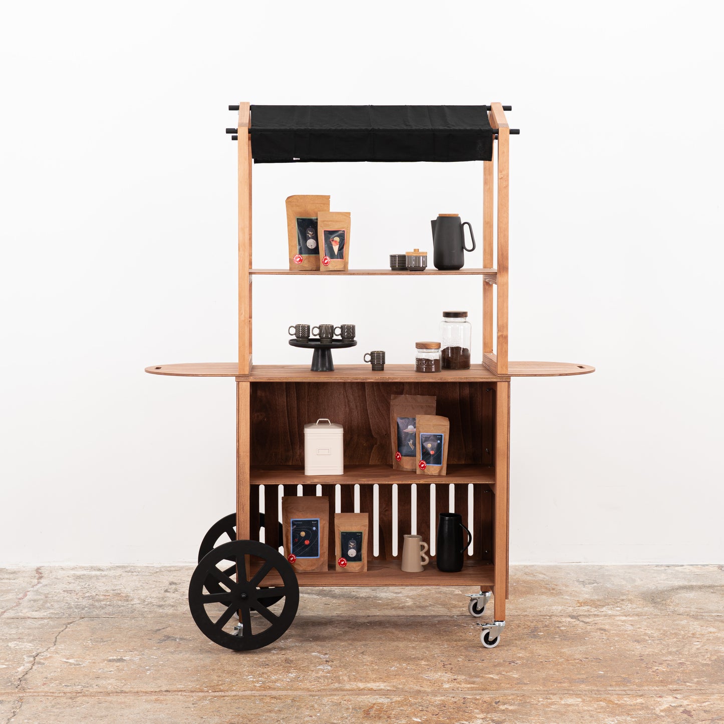 Foldable wooden display cart with shelves and branded panel