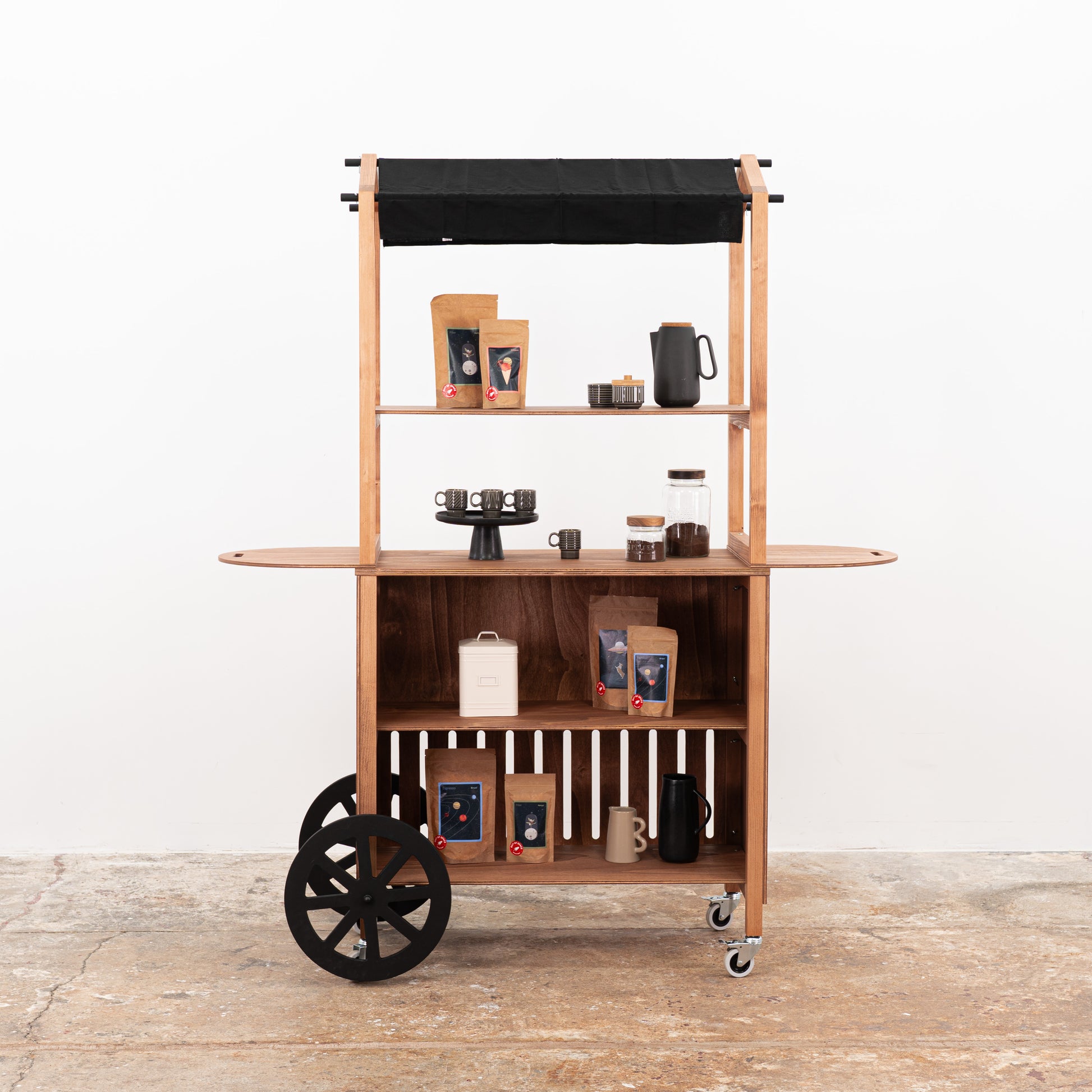 Foldable wooden display cart with shelves and branded panel