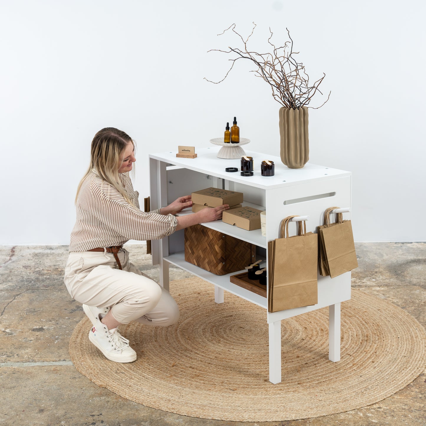 Trade show white counter with under-counter shelving