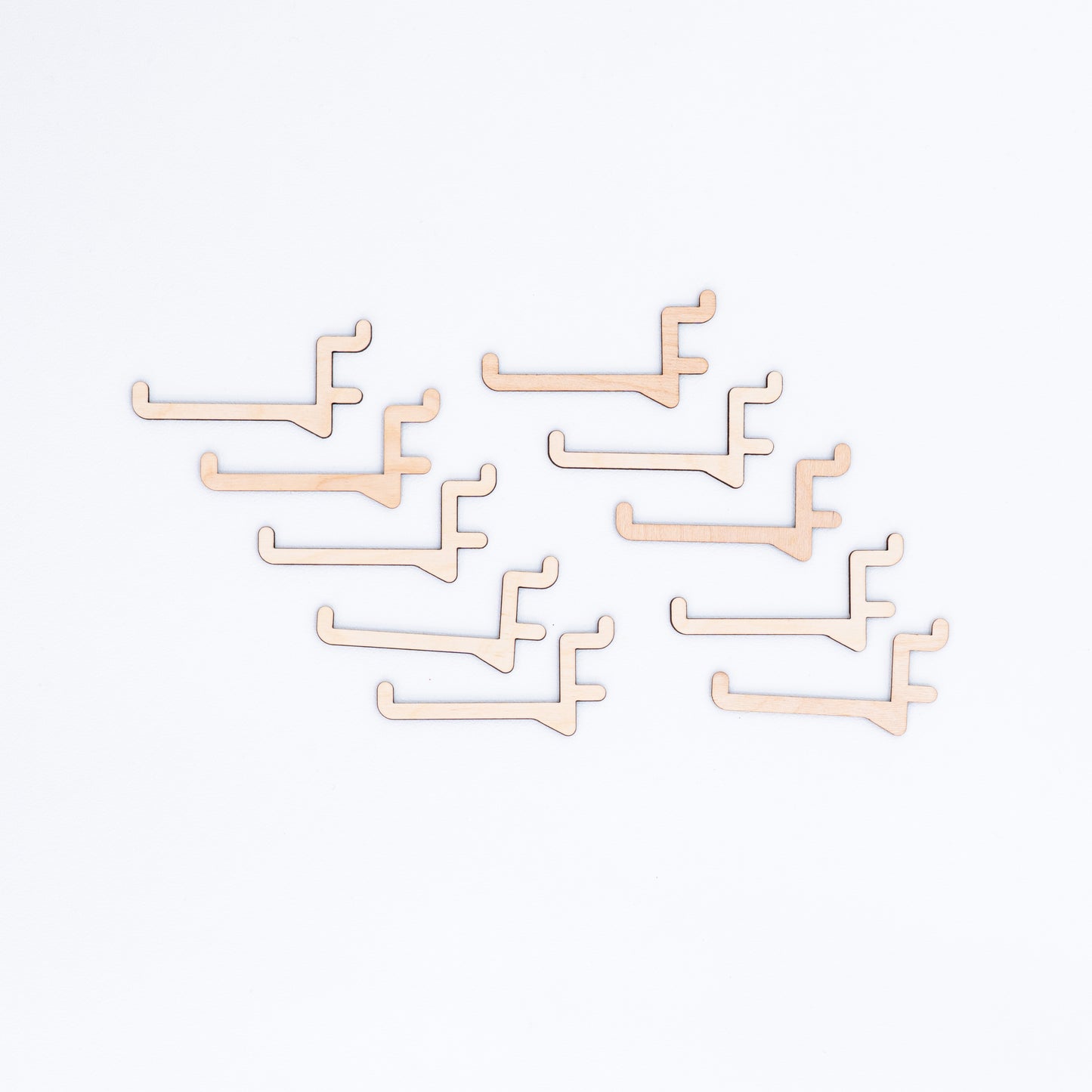 Set of 10 long hooks for pegboards, perfect for displaying larger products like clothing, accessories, and bags in retail and event displays.