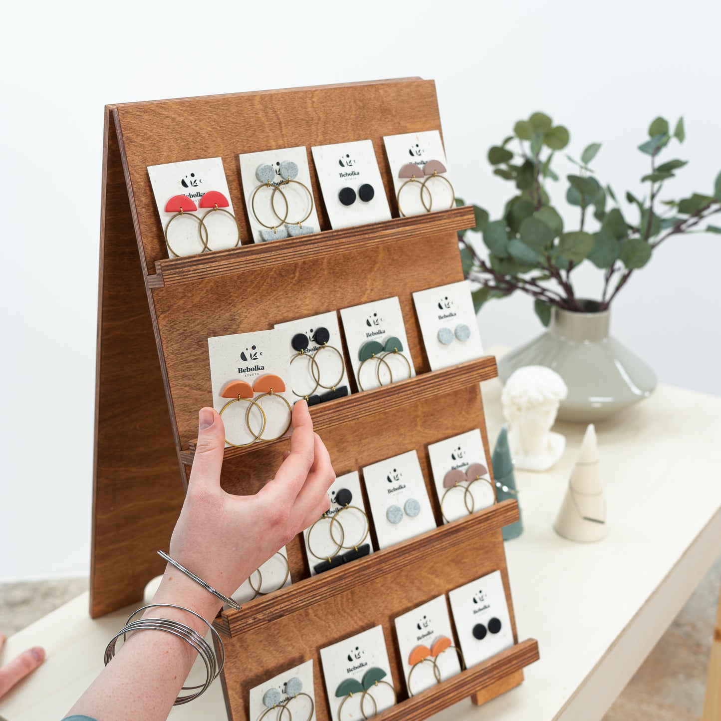 vendor display stand for earrings and postcards at events