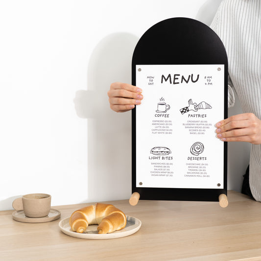 Vertical black tabletop sign with arched top and wooden feet