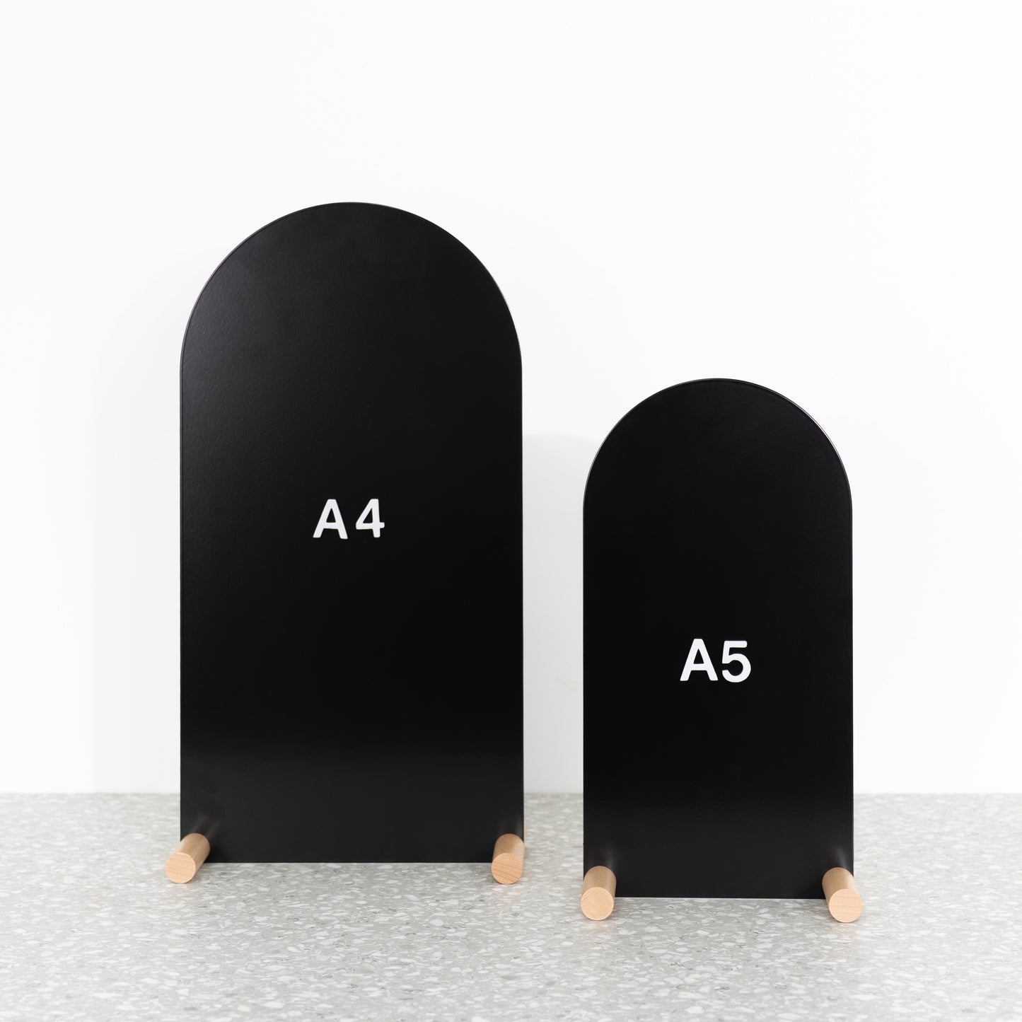 Elegant hospitality sign with black front panel and natural wood base