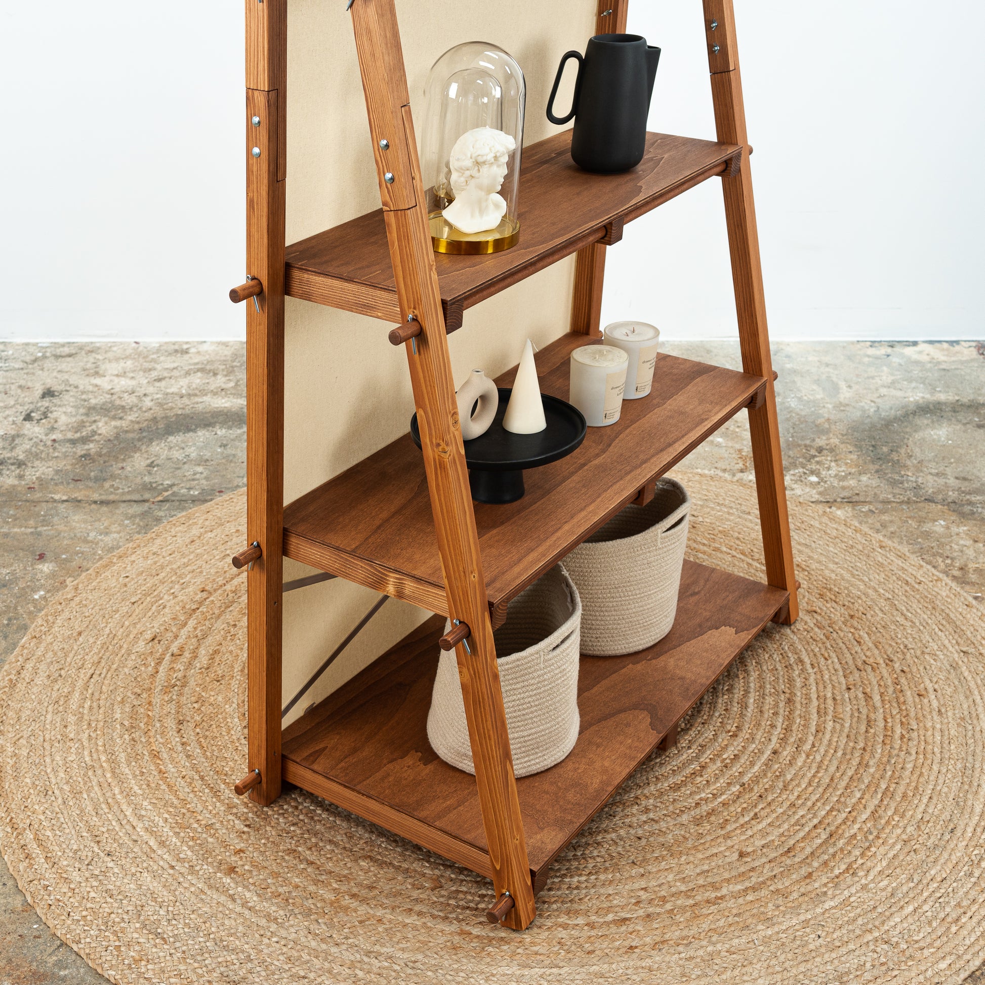 Tool-free modular shelving display in warm wood tone for vendor booths