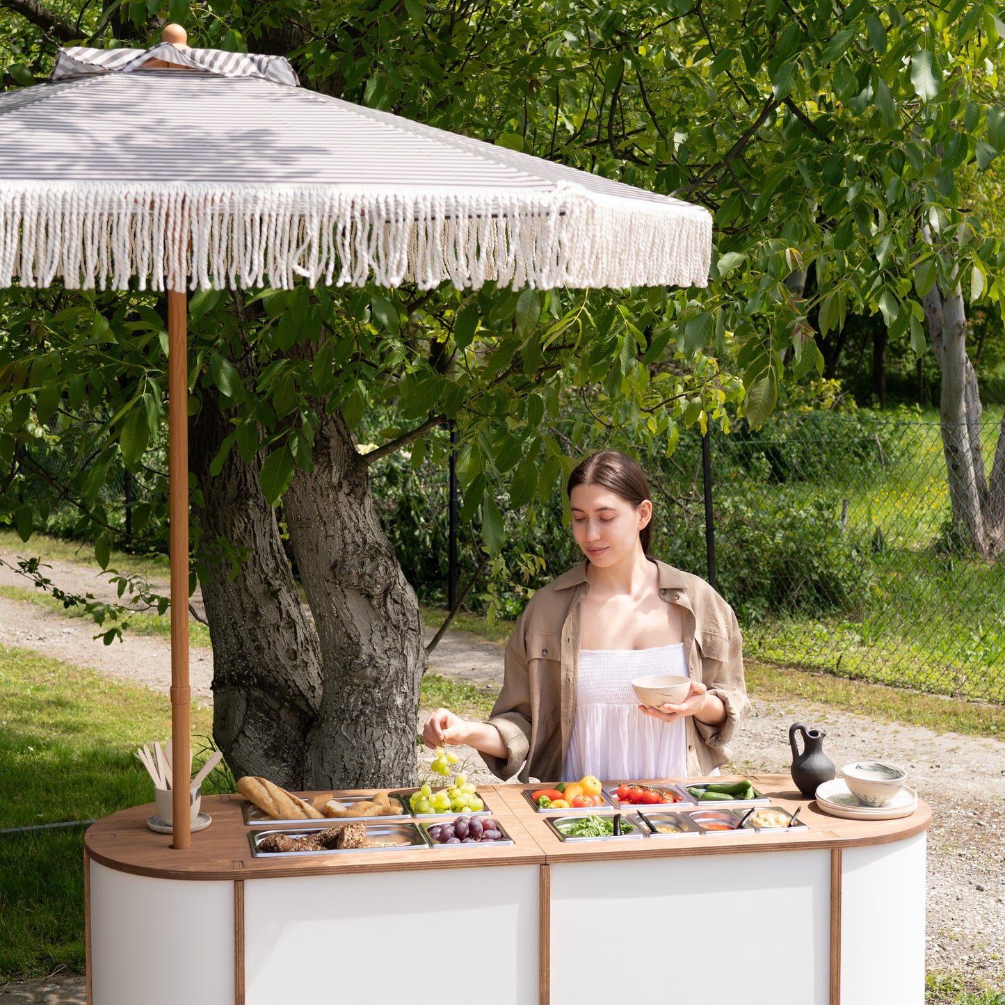 Event catering furniture with umbrella hole and lockable wheels