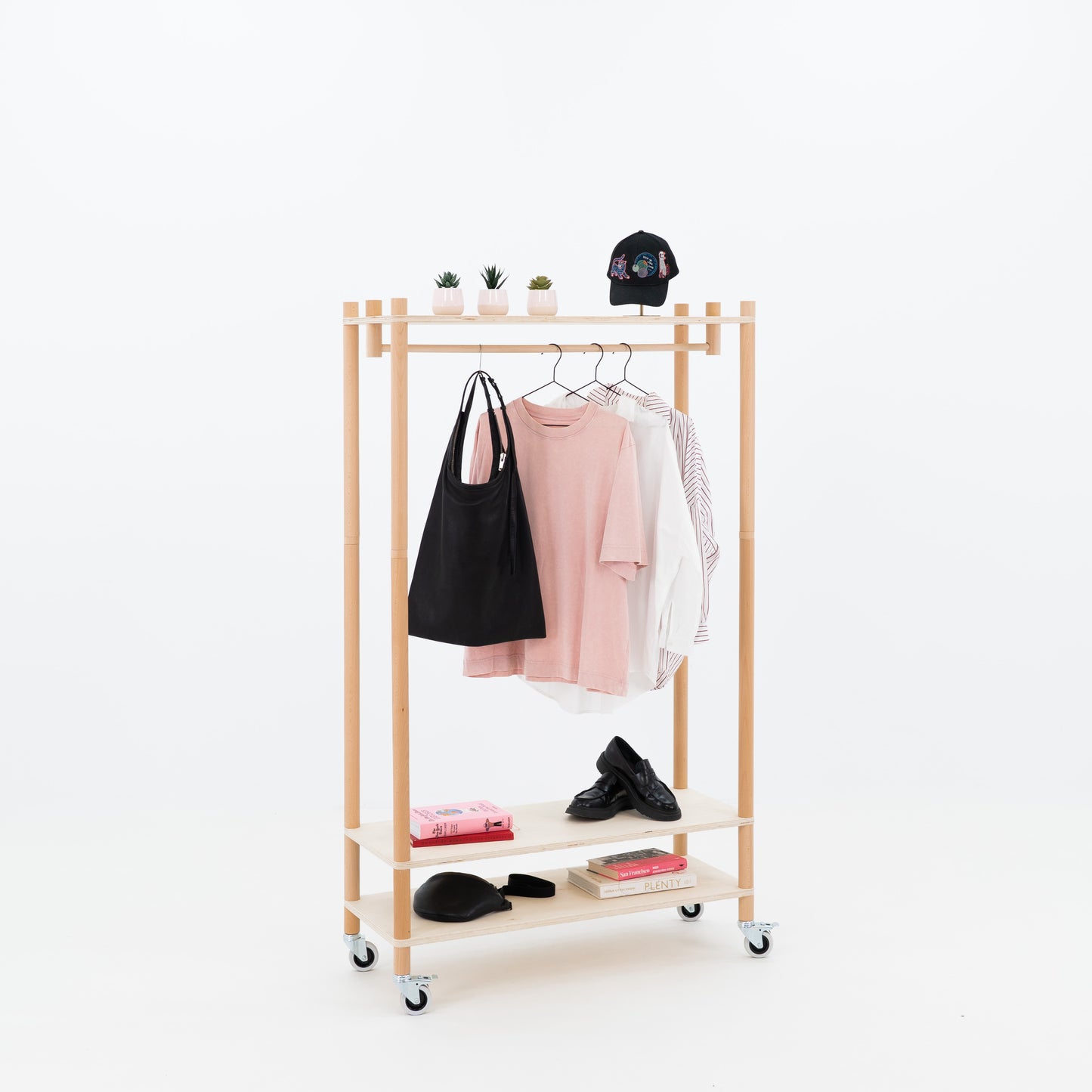 Event merchandising solution with natural wood frame and flat-pack design