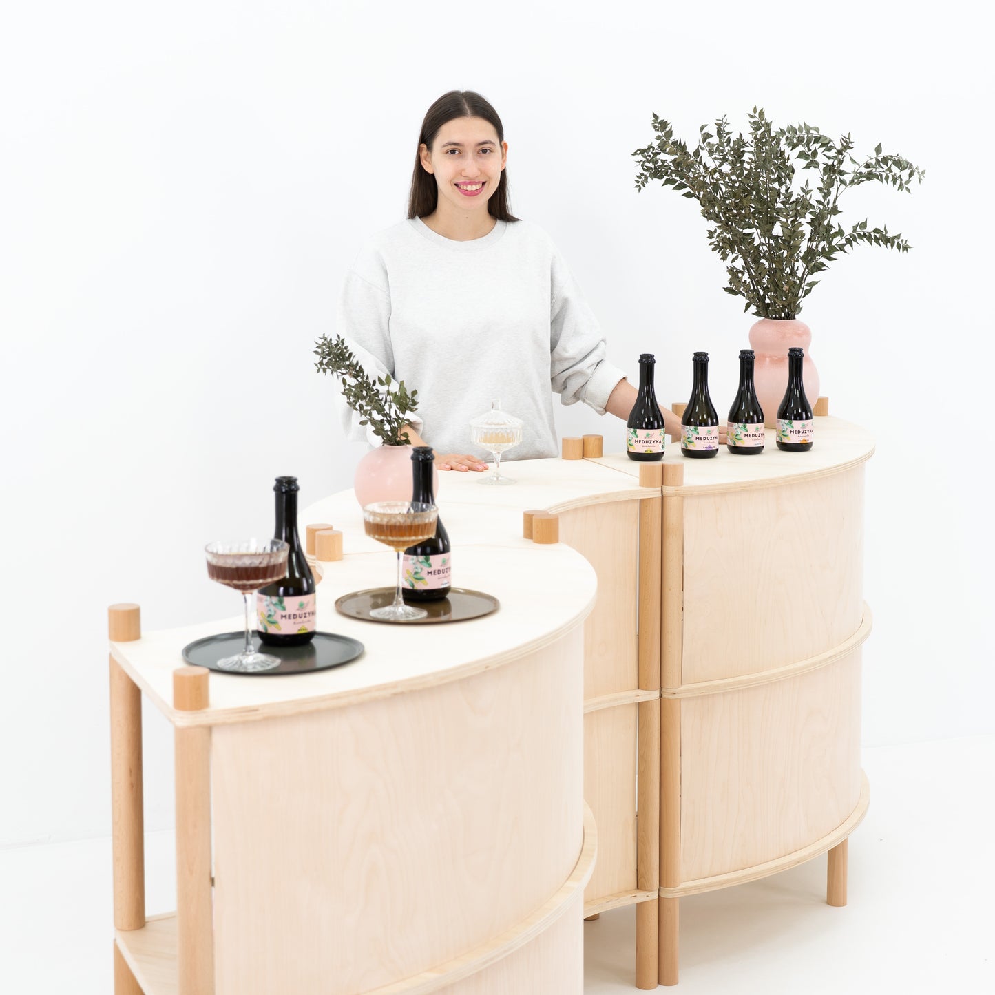 modular wave-shaped retail display counter set with custom branding