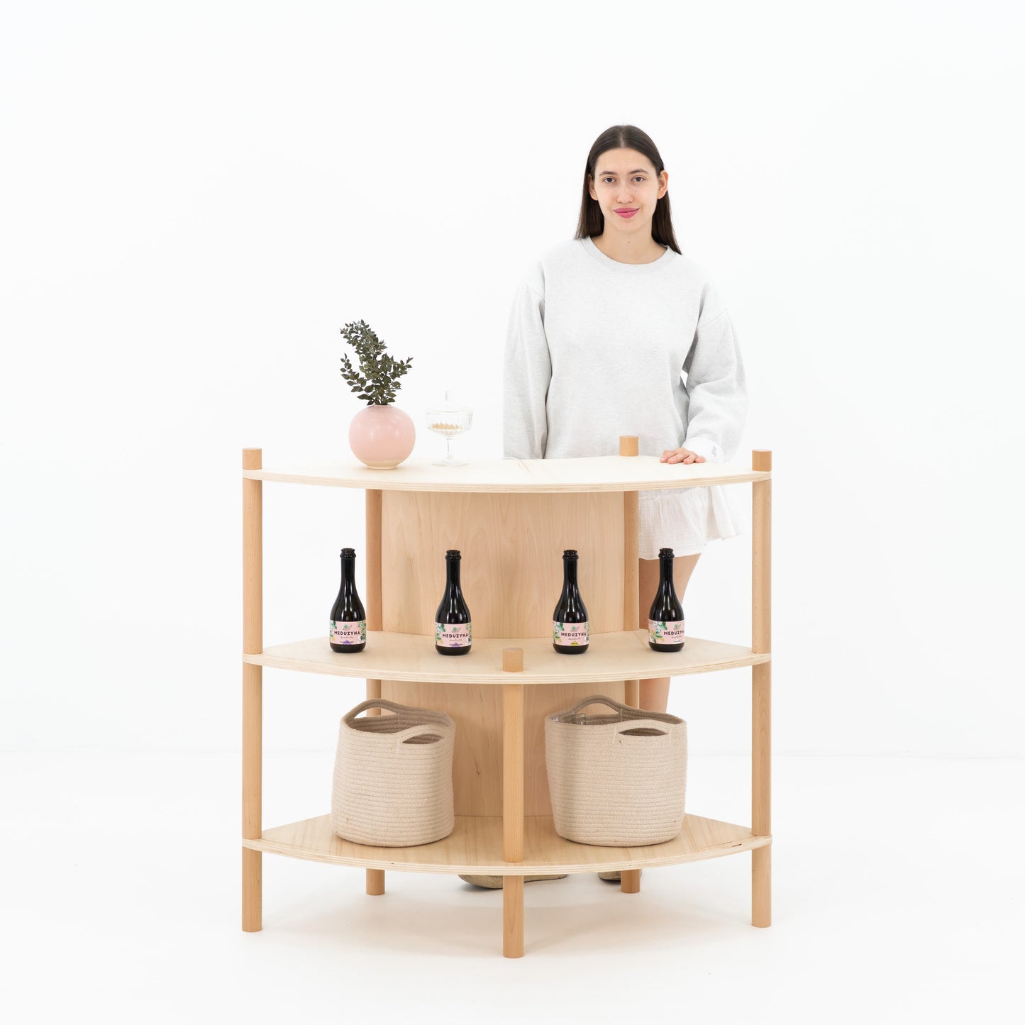 concave front bambuk checkout counter with natural plywood finish
