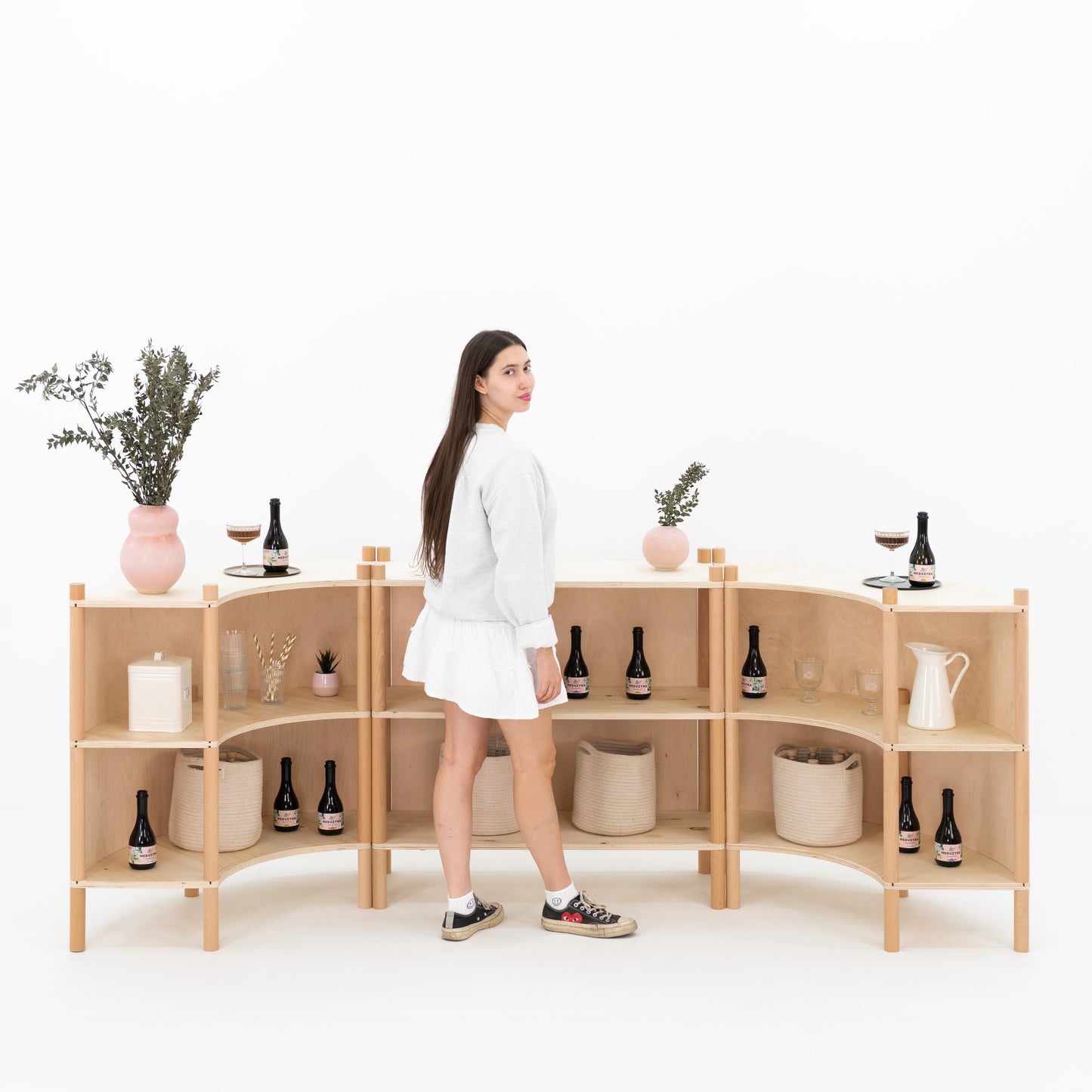 Pop-up retail counter with storage and customer-facing curved front