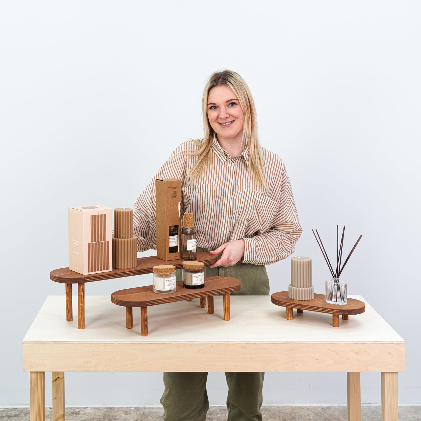 Coffee finish wooden riser set showcasing jewelry and beauty products