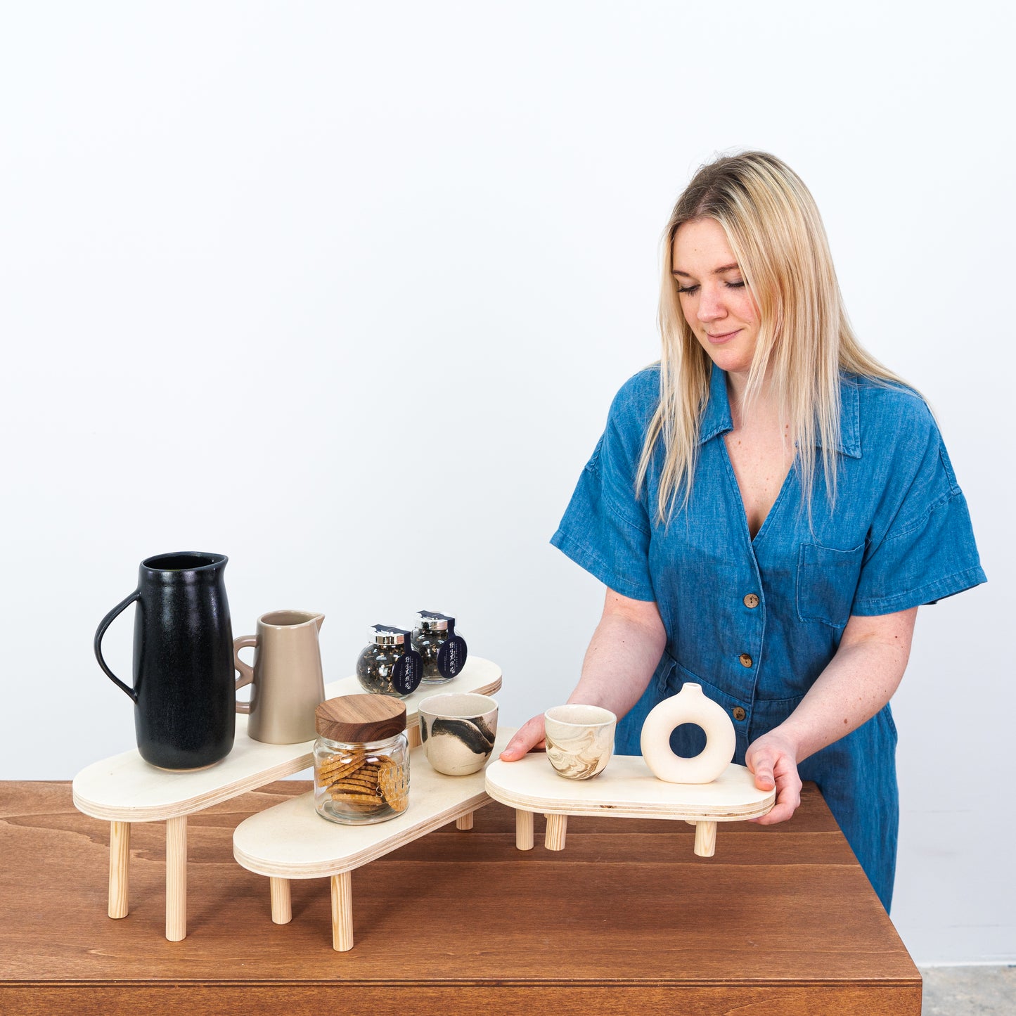 Three-tier wooden display stands ideal for eco-conscious brands
