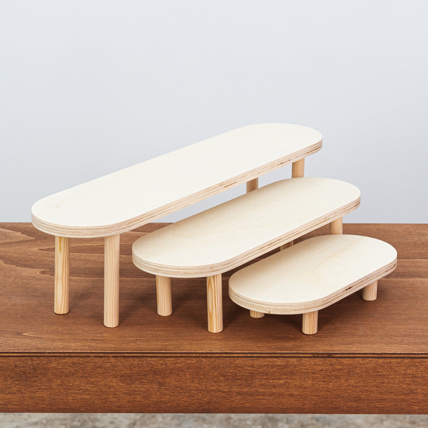 Flat-pack wooden risers for premium retail spaces and exhibitions