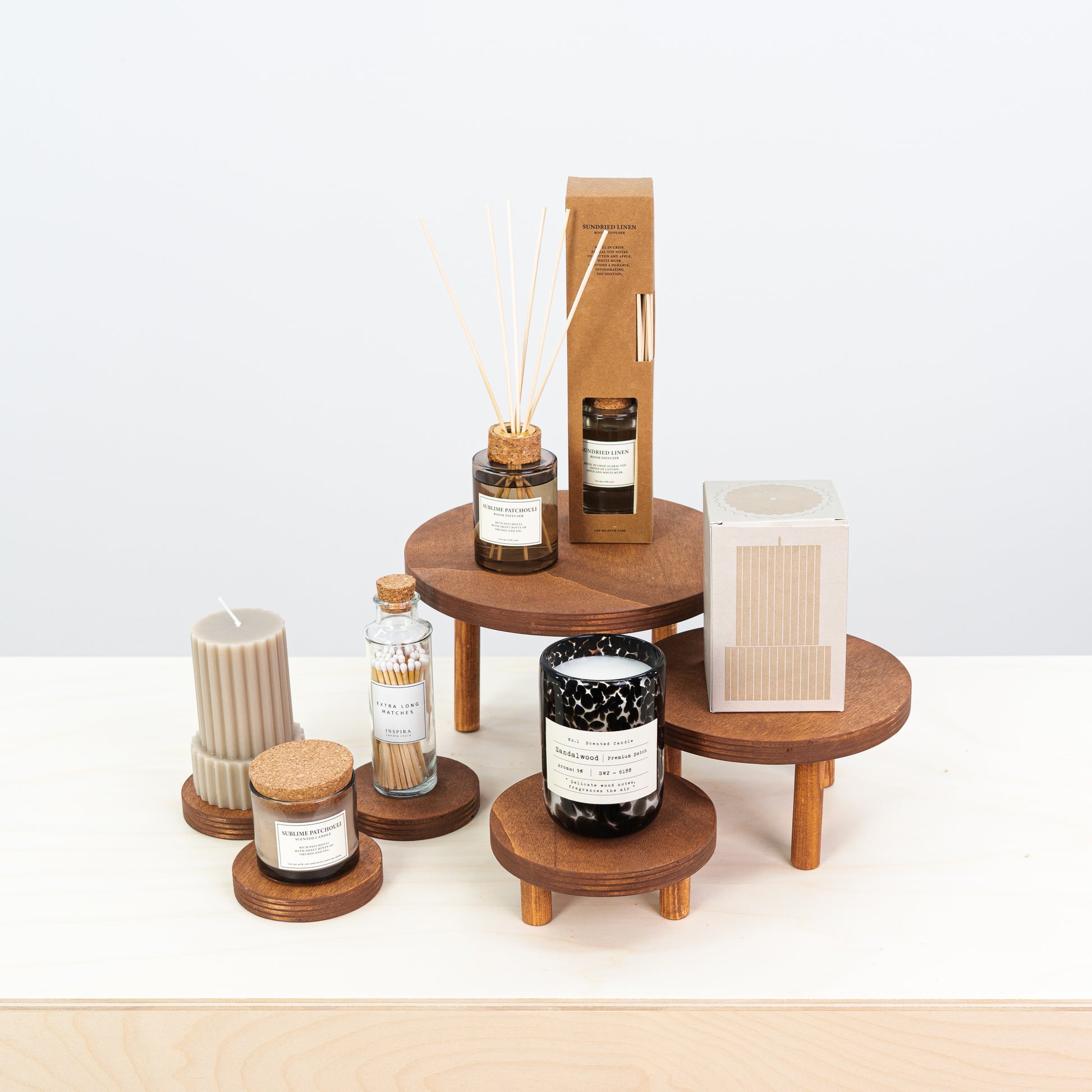 set of 3 wooden risers with matching coasters for product display