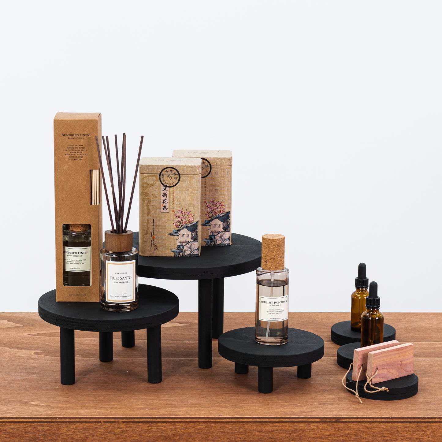 set of 3 black wooden risers with coasters for trade show displays