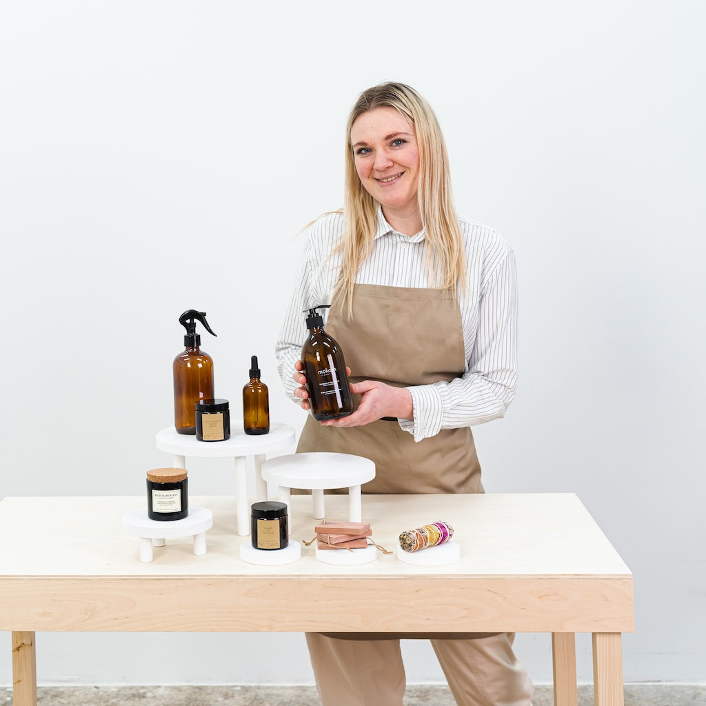 foldable white plywood risers for candles and skincare products
