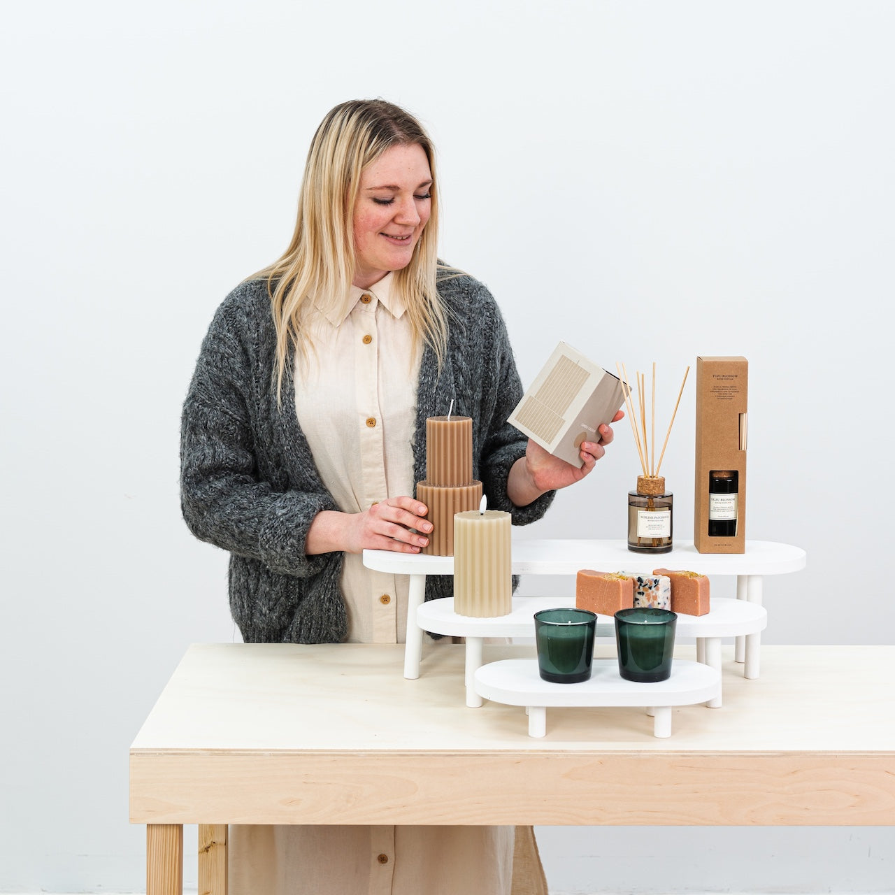 Elegant white display stands for ceramics and beauty products