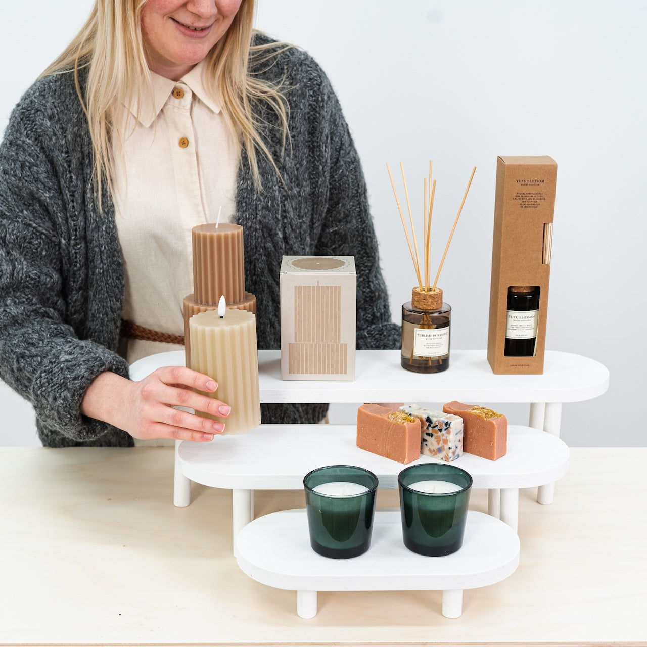 Foldable white wooden risers in three sizes for boutiques and salons
