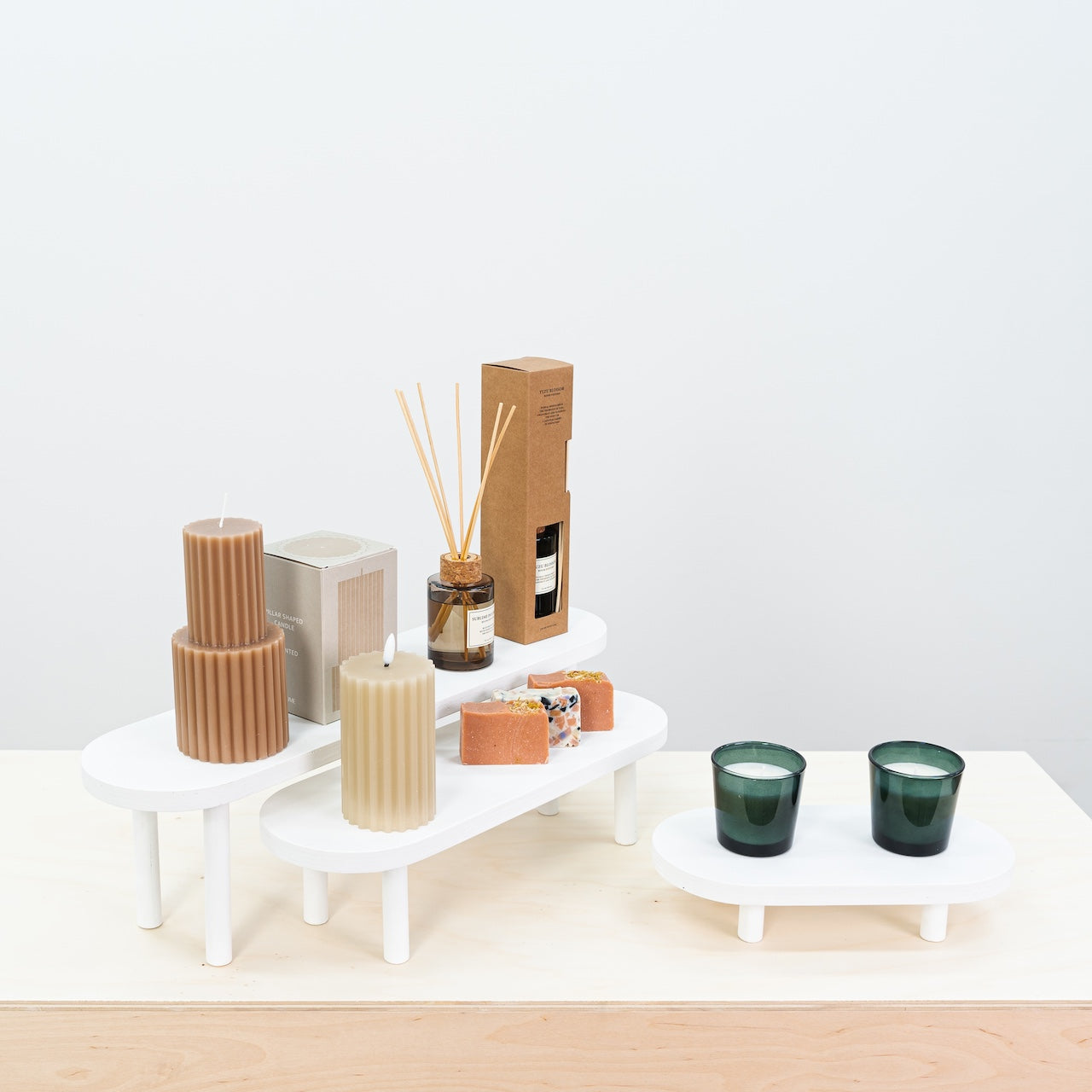 Set of 3 white wooden display risers for minimalist retail presentation