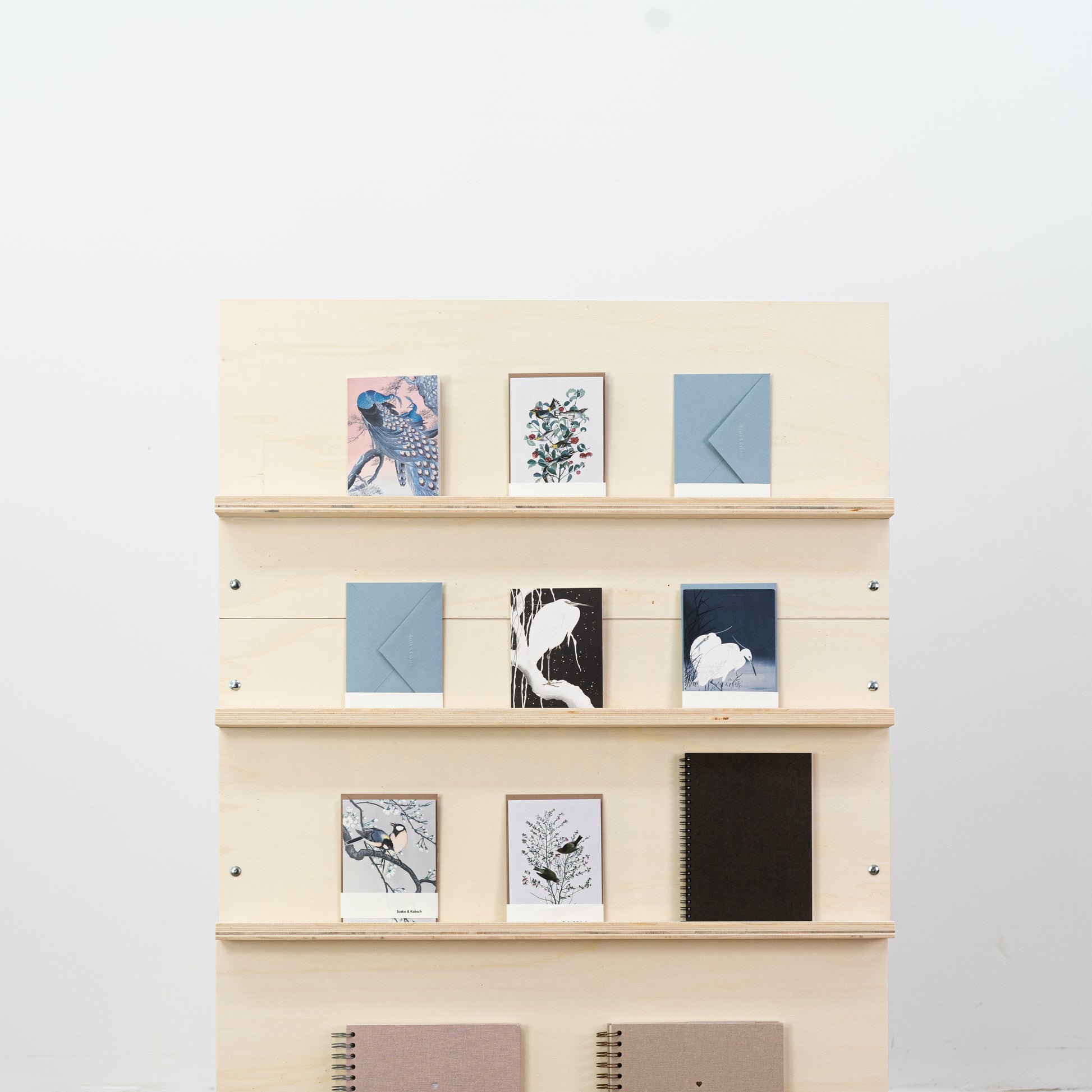 Dual-panel wooden magazine display in vertical configuration