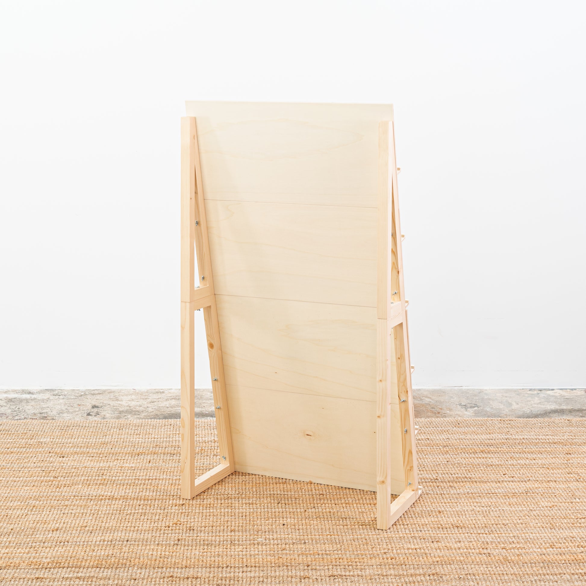 Display unit showcasing minimal stationery in natural tones