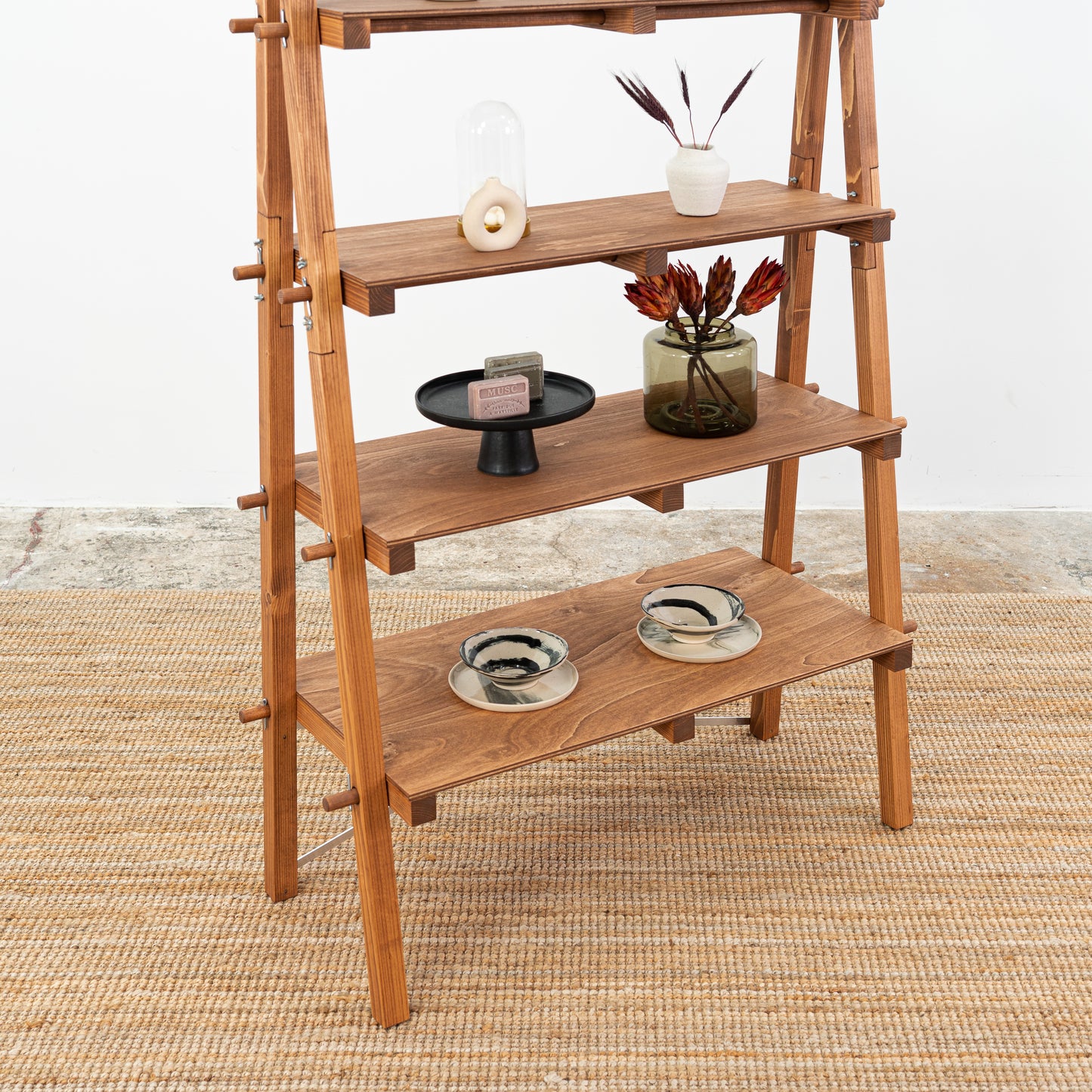 Compact, collapsible A-frame shelf with earthy tones for sustainable brands