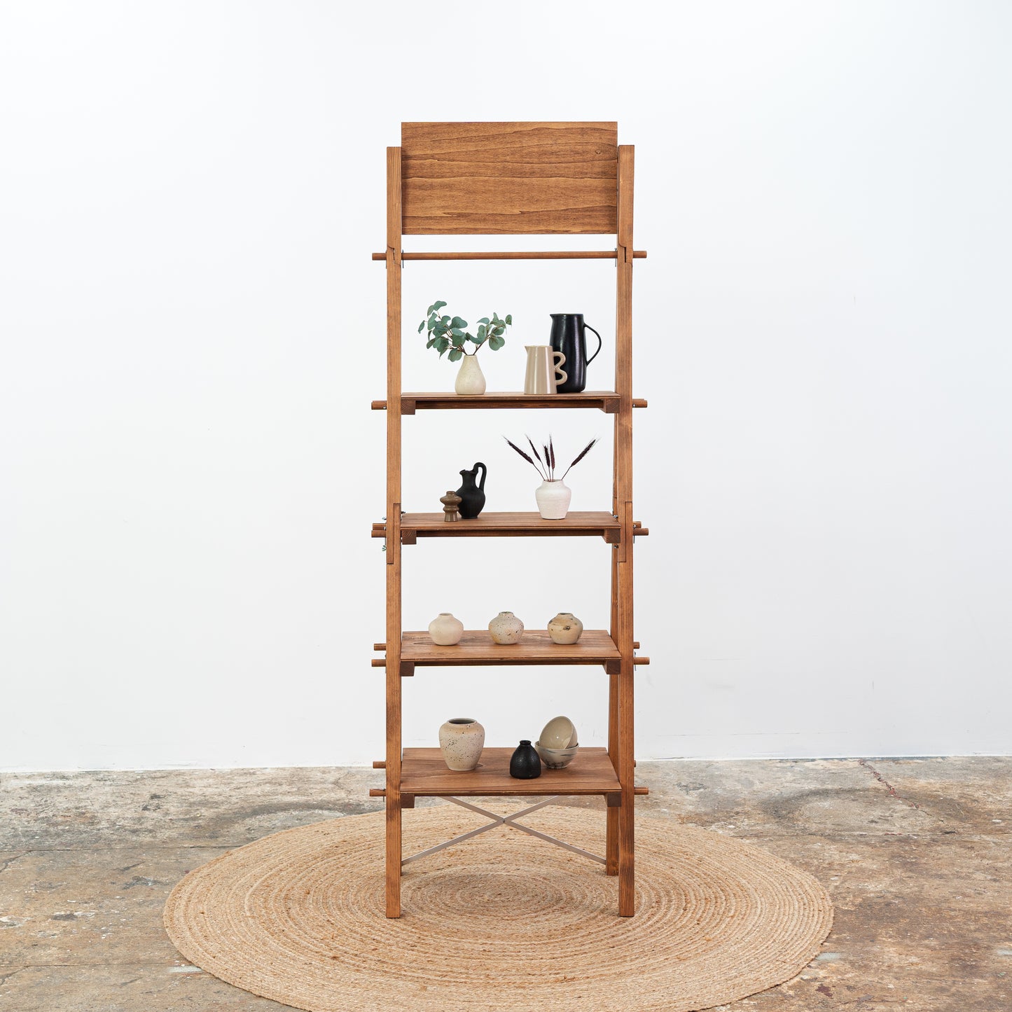 Close-up of coffee stained angled retail display for handmade goods