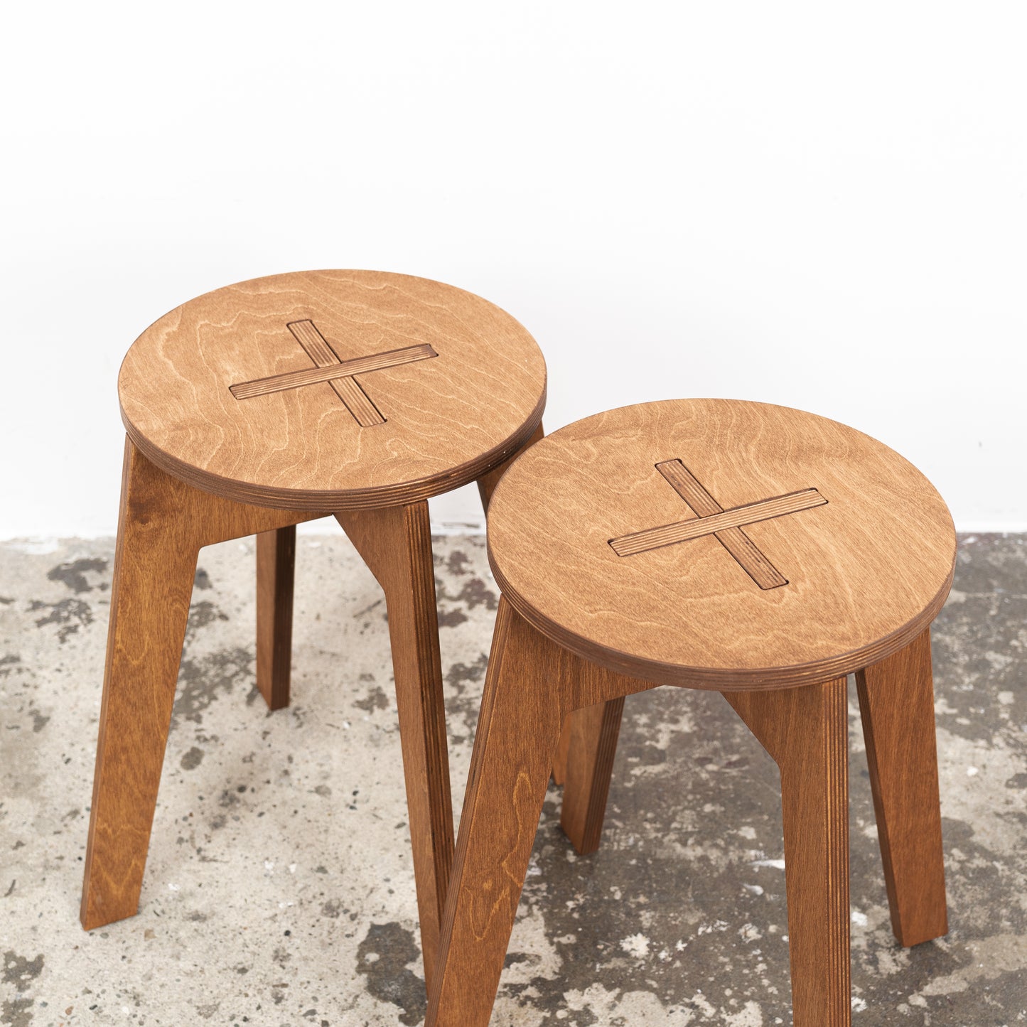 Warm-toned plywood stool with tool-free setup