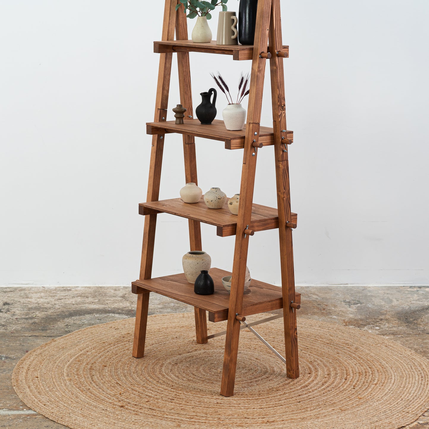 Coffee-tone freestanding shelf with modern product arrangement