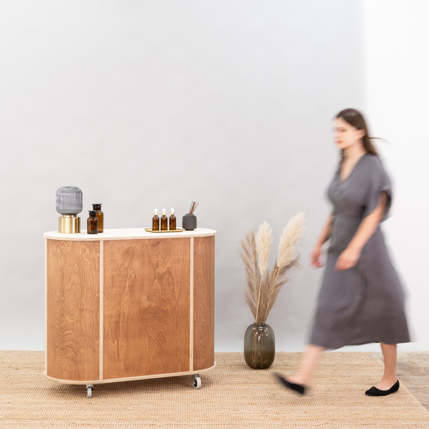Sleek oval counter with storage for retail events and promotions.