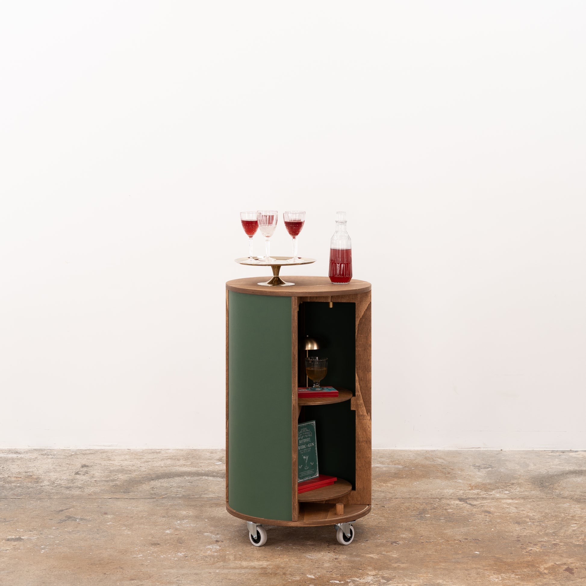 Wooden round host stand with elegant shelving and smooth design, ideal for product display at exhibitions or trade shows.