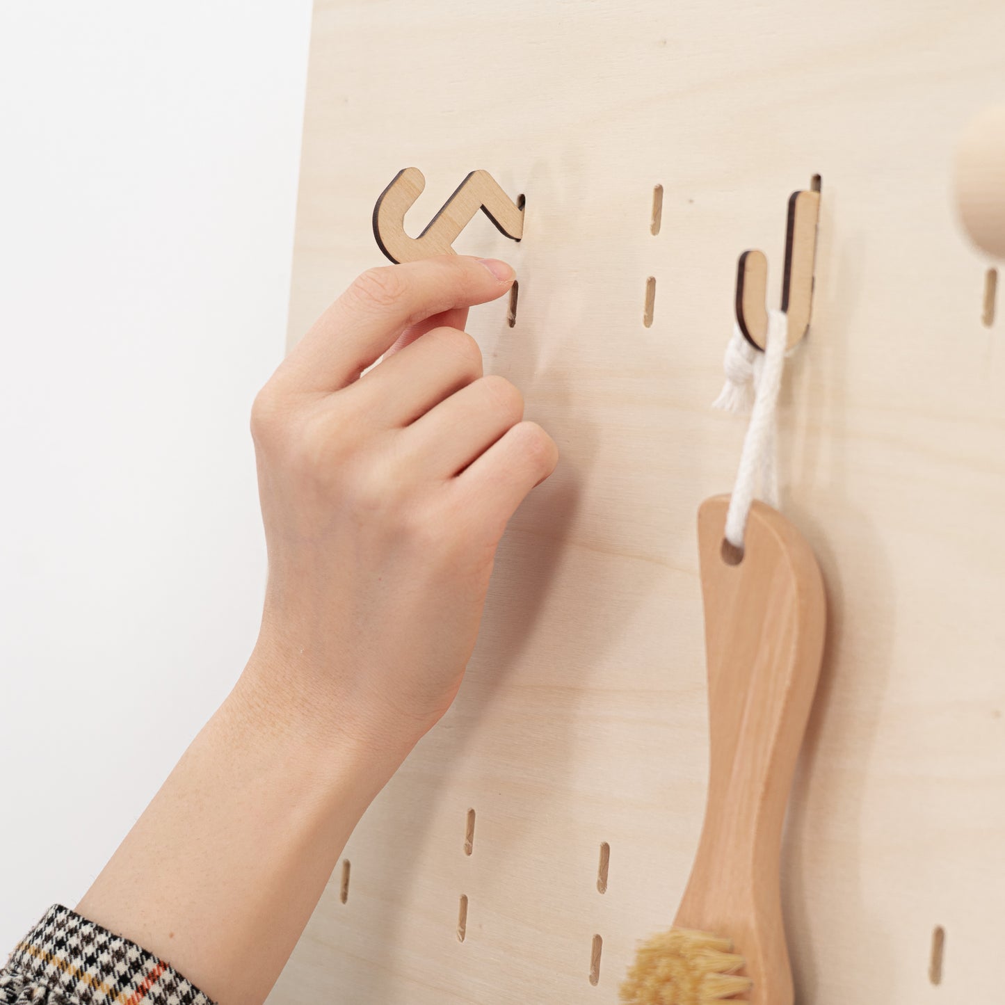 Durable plywood short hooks for pegboards, offering a versatile and functional display solution for accessories and small products.