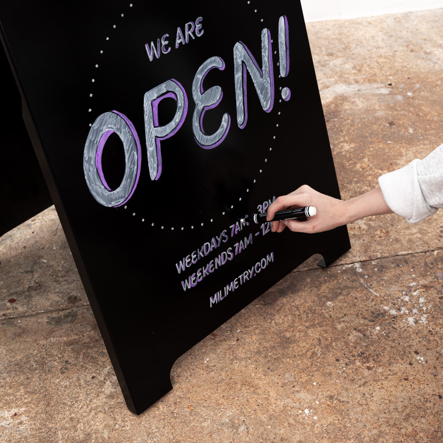 Minimal black sandwich sign with writable surface