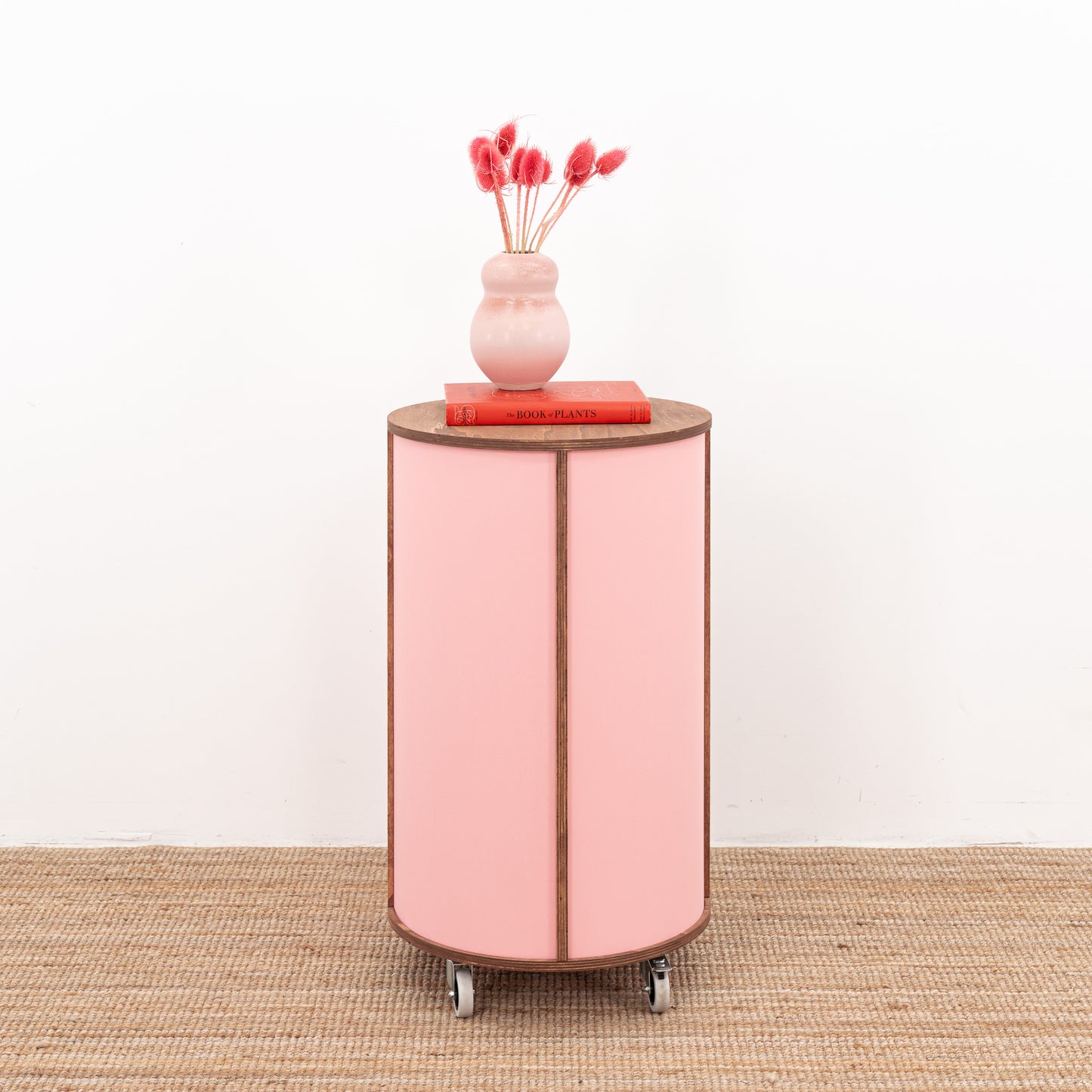 Round host stand with open shelving and a contemporary finish, ideal for retail or hospitality environments.