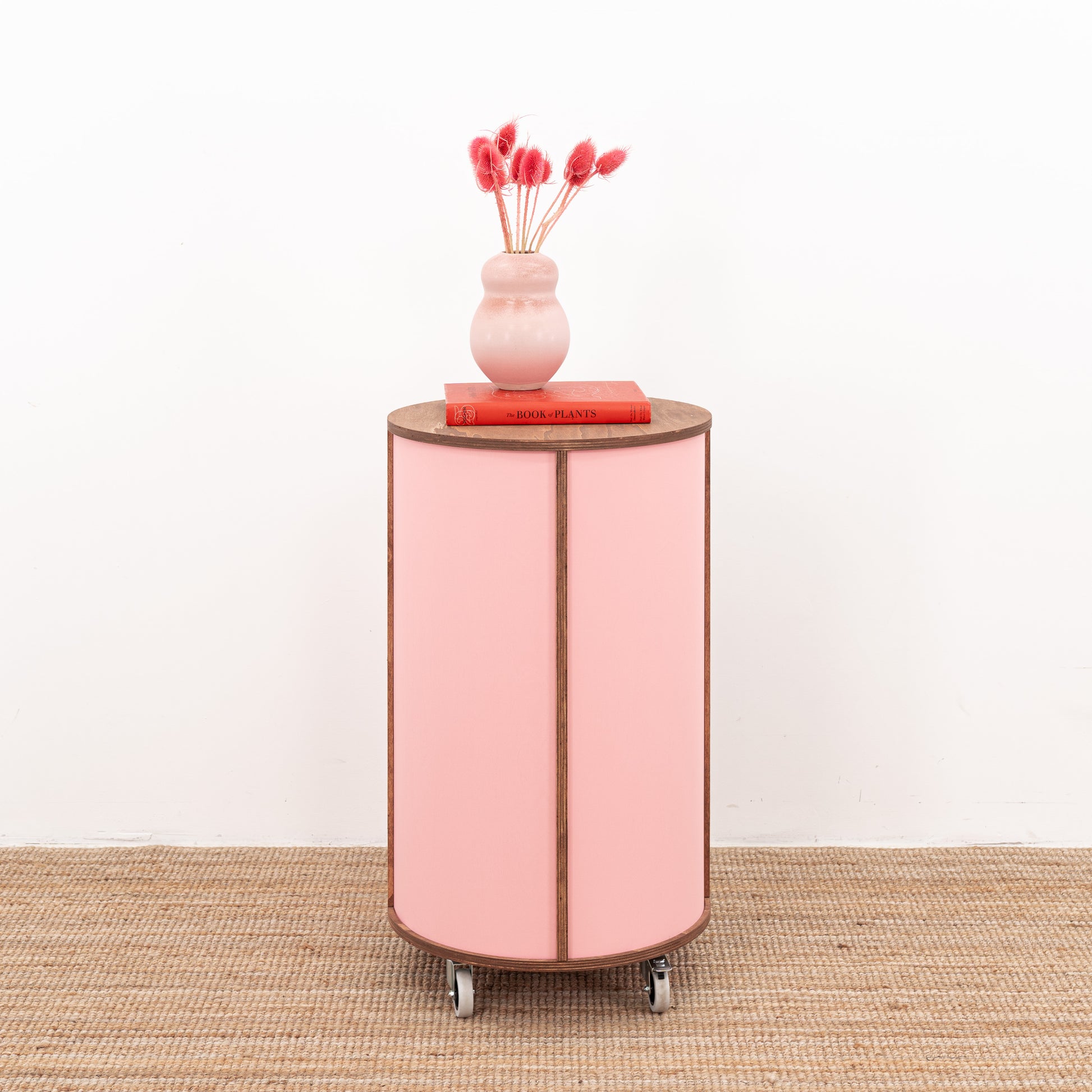 Round host stand with open shelving and a contemporary finish, ideal for retail or hospitality environments.
