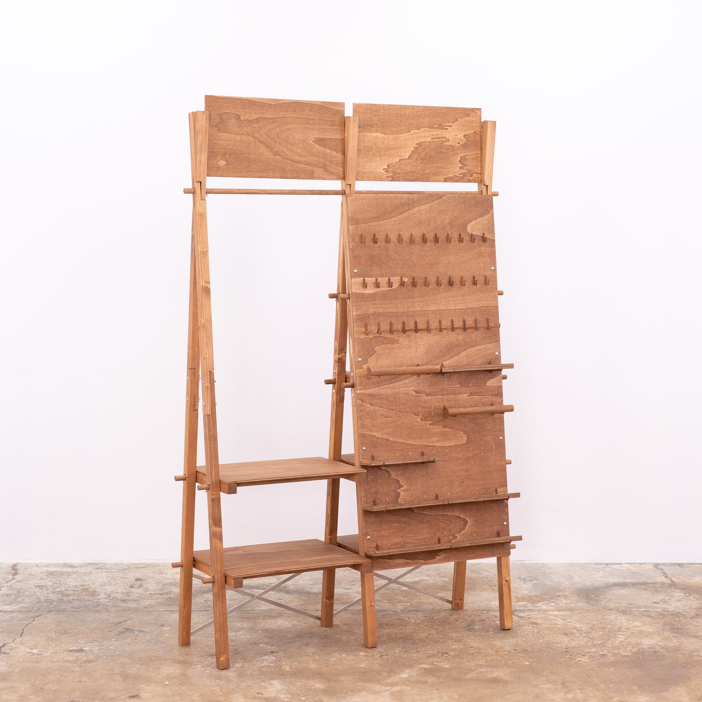 Wooden trade show stand with customizable signage and shelving tiers