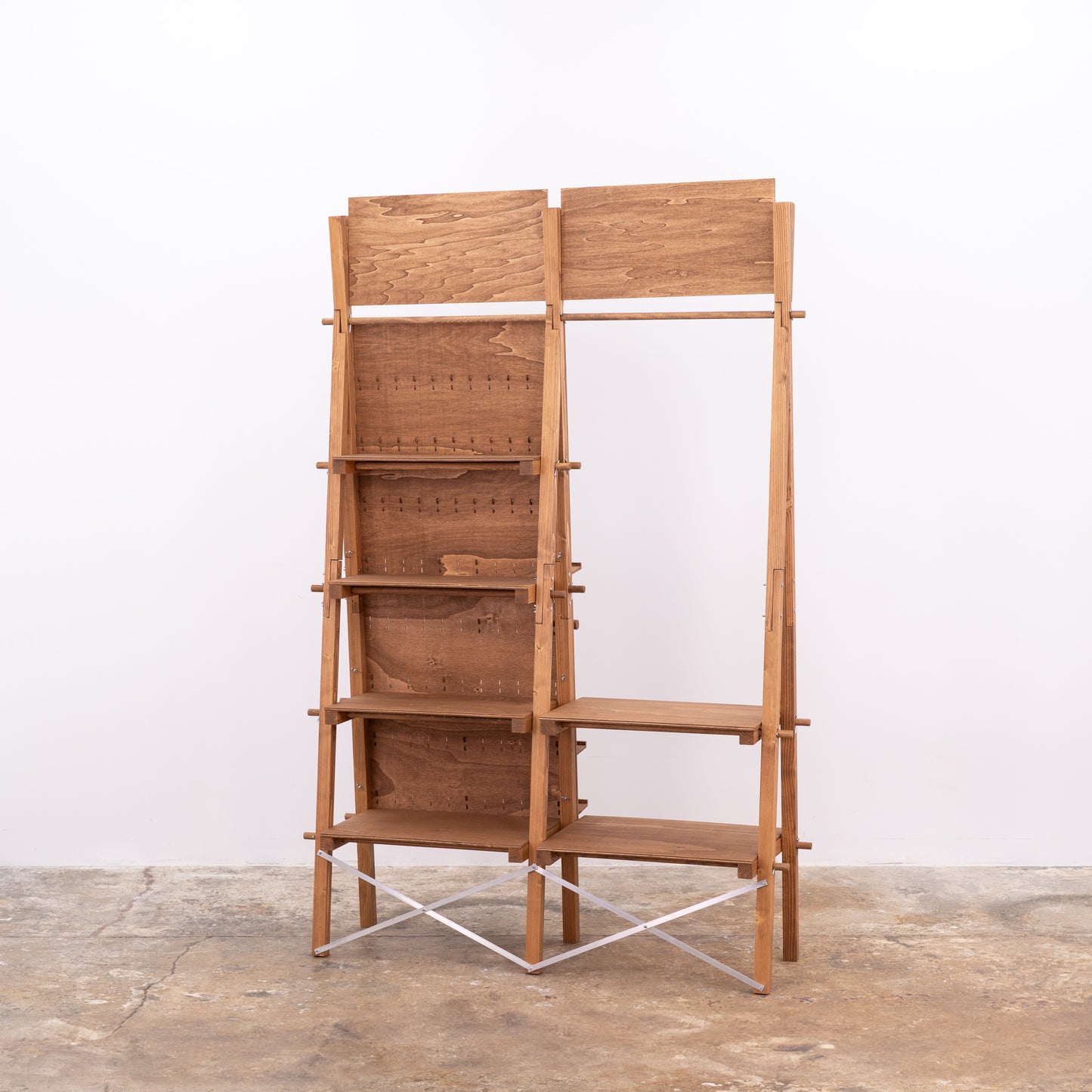 Coffee-colored display stand with modular shelving and rail system