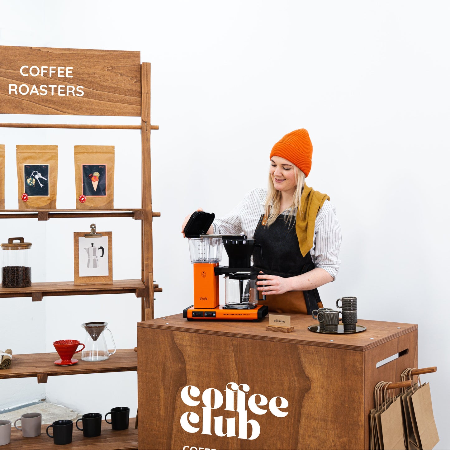 Compact retail booth with shelving