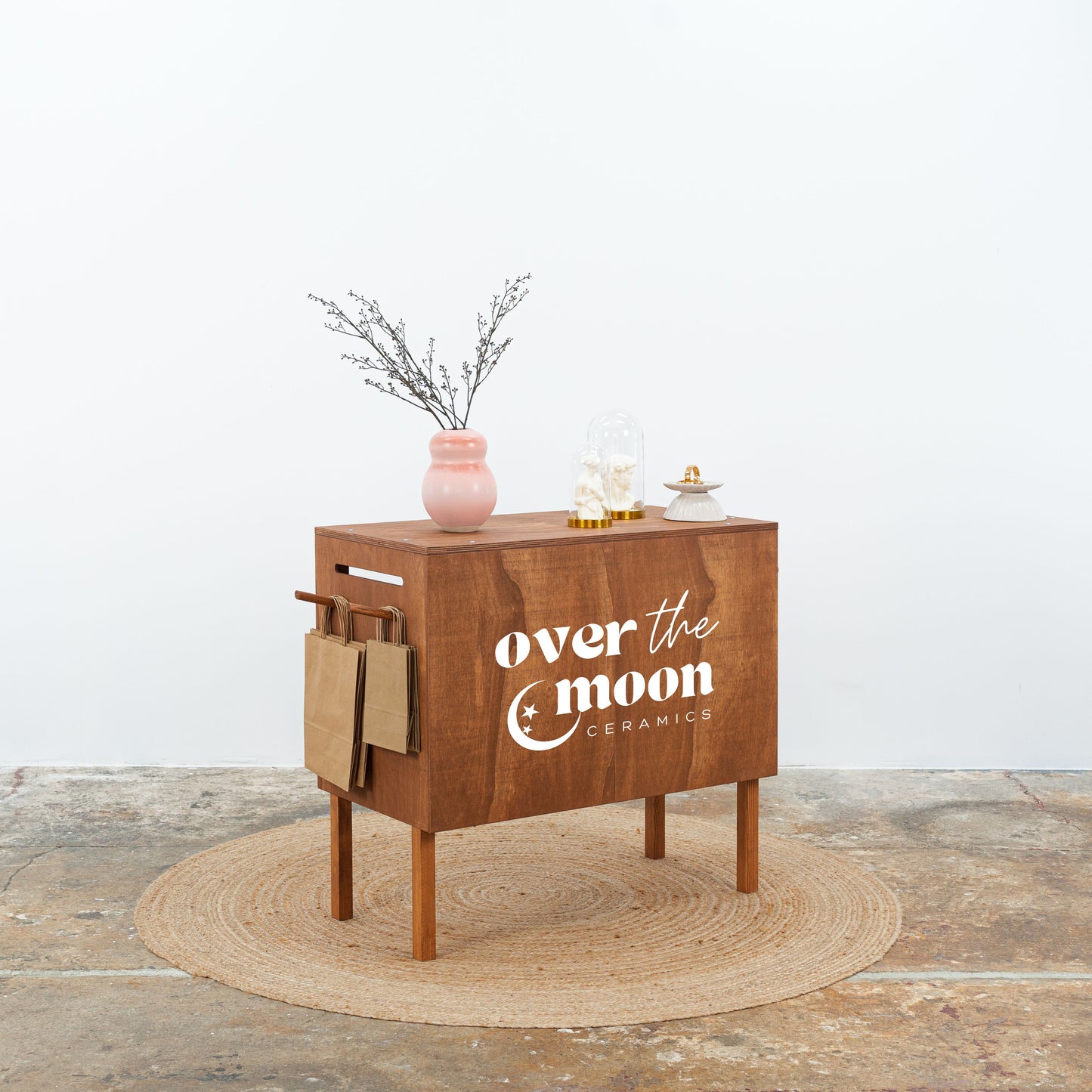 Collapsible coffee-colored POS counter with storage