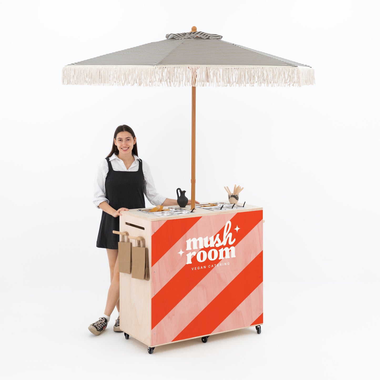 Flat-pack catering trolley featuring gastronorm inserts and umbrella holder