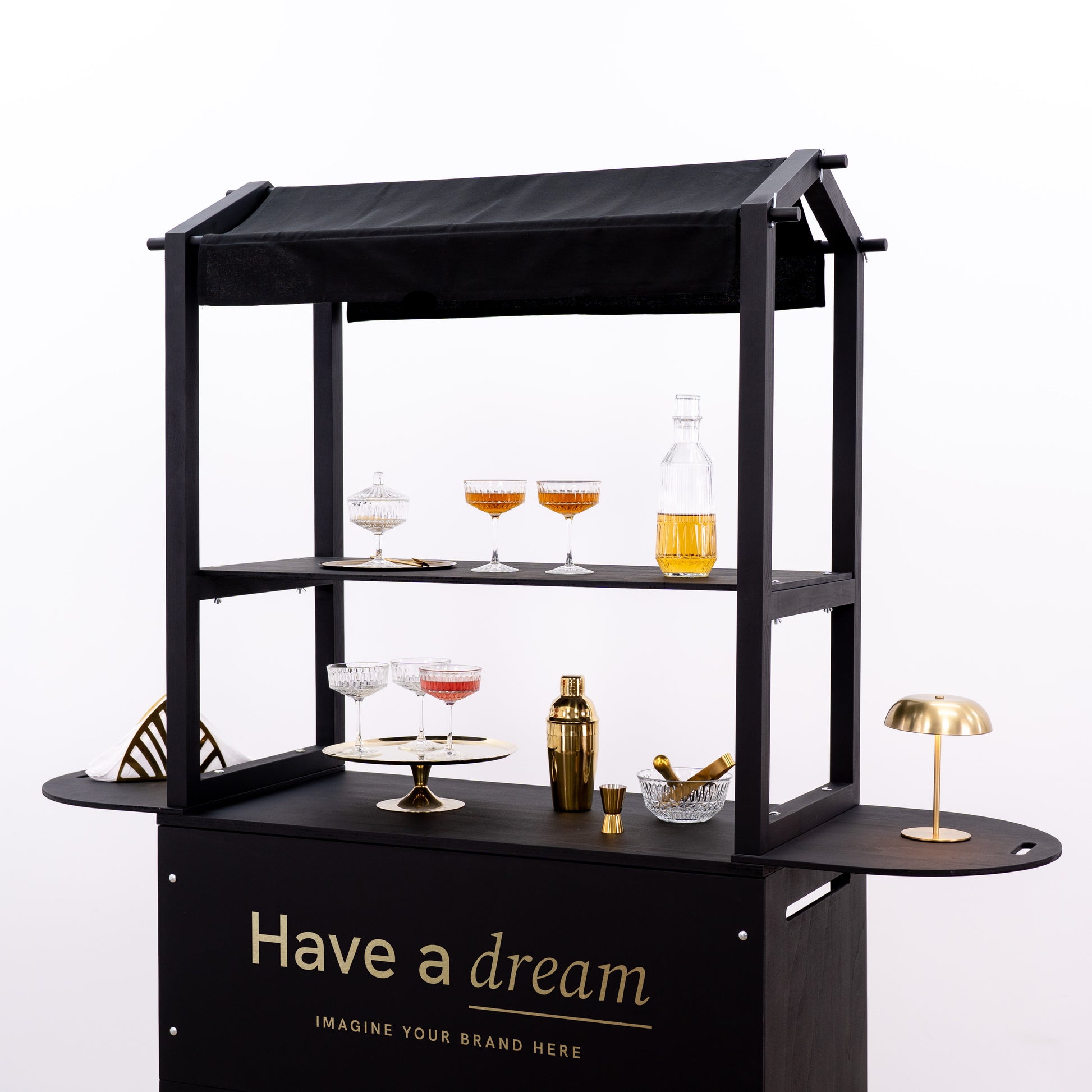 Portable serving cart with a minimalist design, offering ample display space for drinkware and decor items.
