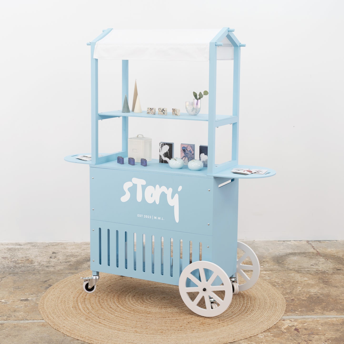 Light blue pastel cart with white canopy – minimalist event setup